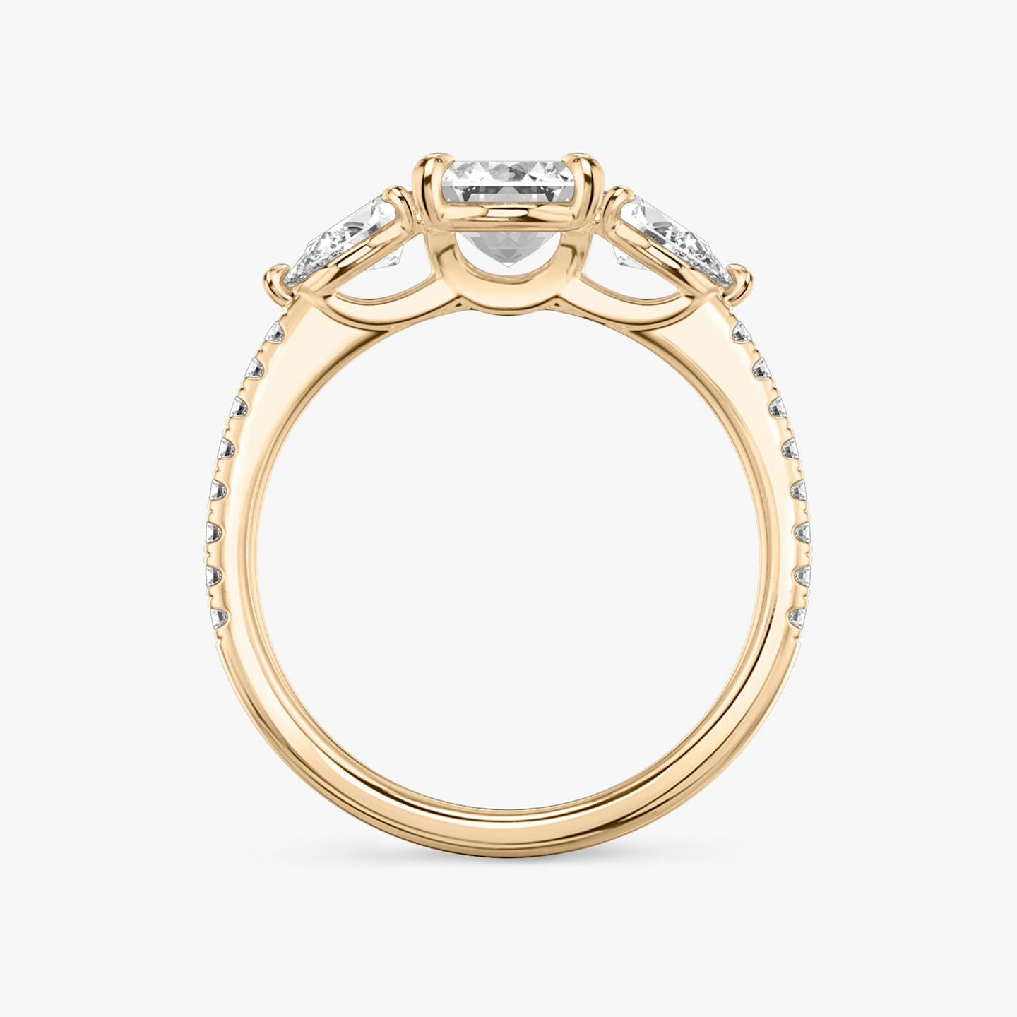 The Three Stone | Emerald | 14k | 14k Rose Gold | Band: Pavé | Side stone carat: 1/4 | Side stone shape: Pear | Diamond orientation: vertical | Carat weight: See full inventory