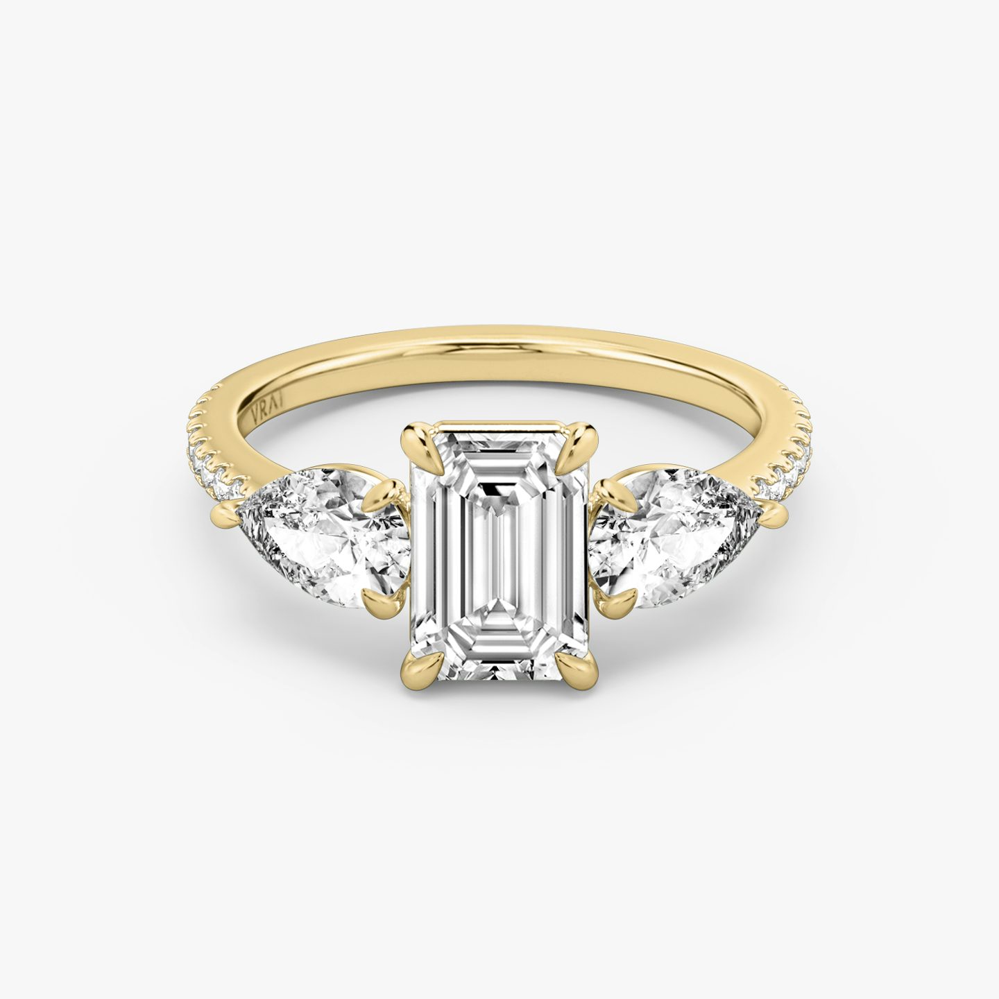The Three Stone | Emerald | 18k | 18k Yellow Gold | Band: Pavé | Side stone carat: 1/2 | Side stone shape: Pear | Diamond orientation: vertical | Carat weight: See full inventory