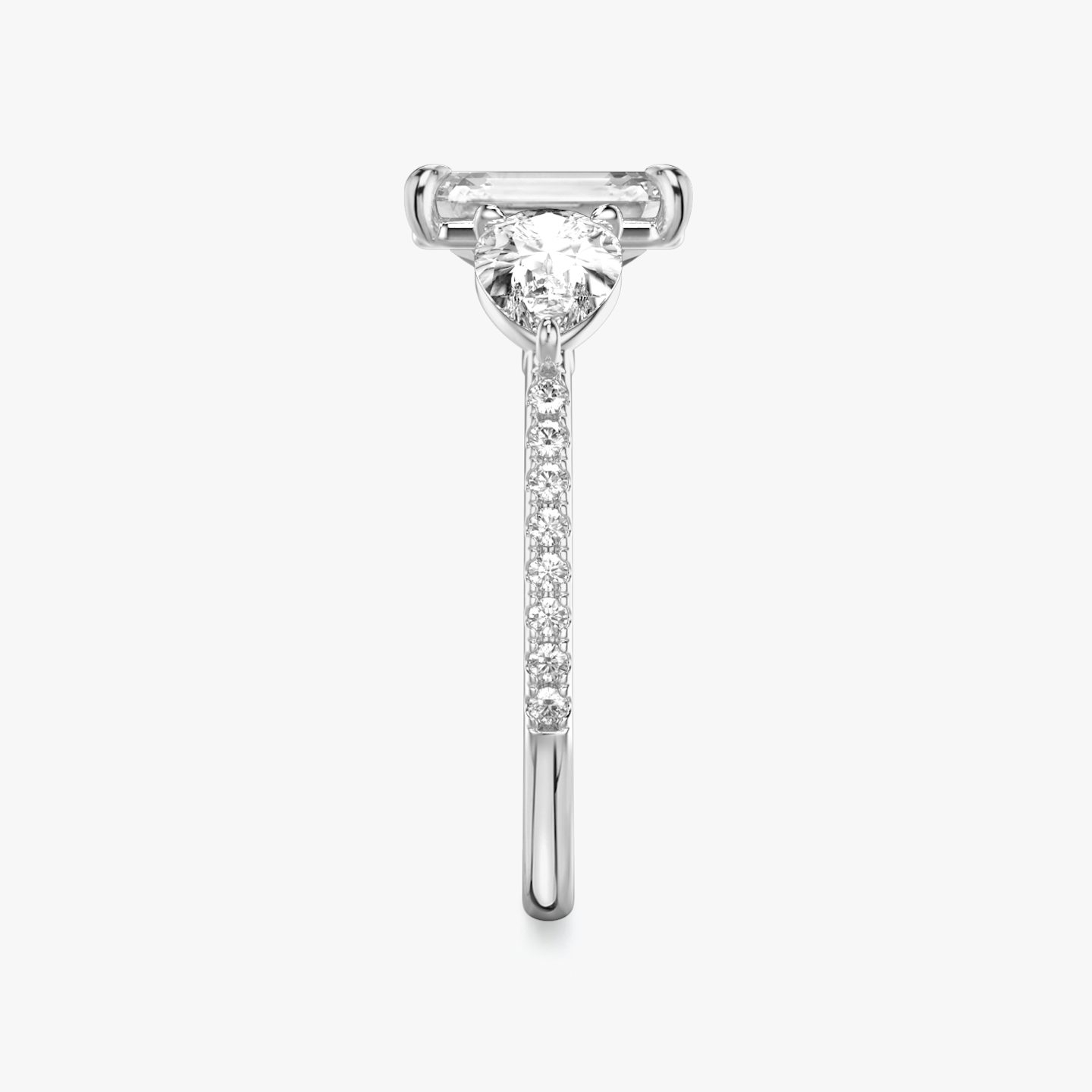 The Three Stone | Emerald | 18k | 18k White Gold | Band: Pavé | Side stone carat: 1/2 | Side stone shape: Pear | Diamond orientation: vertical | Carat weight: See full inventory