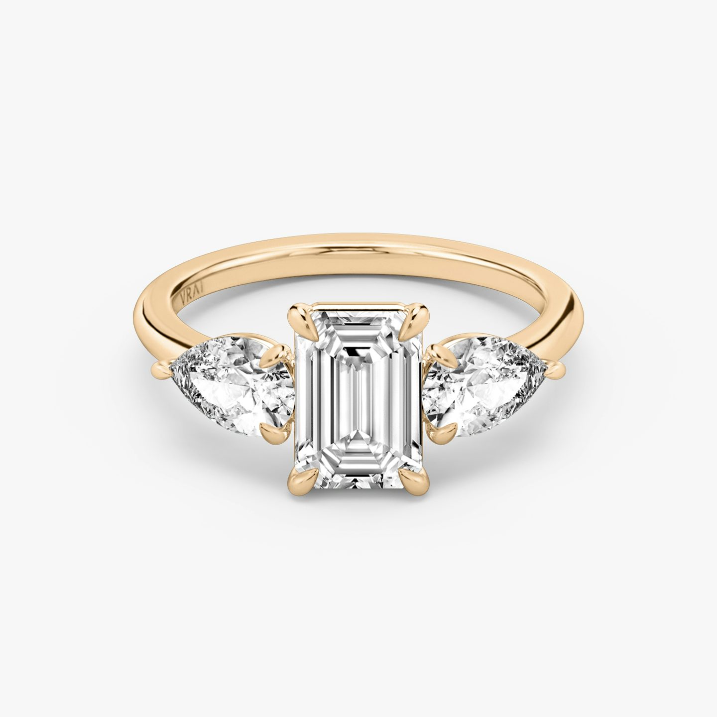 The Three Stone | Emerald | 14k | 14k Rose Gold | Band: Plain | Side stone carat: 1/2 | Side stone shape: Pear | Diamond orientation: vertical | Carat weight: See full inventory