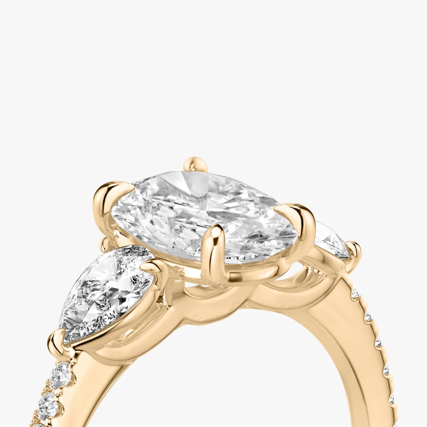 The Three Stone | Oval | 14k | 14k Rose Gold | Band: Pavé | Side stone carat: 1/4 | Side stone shape: Pear | Diamond orientation: vertical | Carat weight: See full inventory