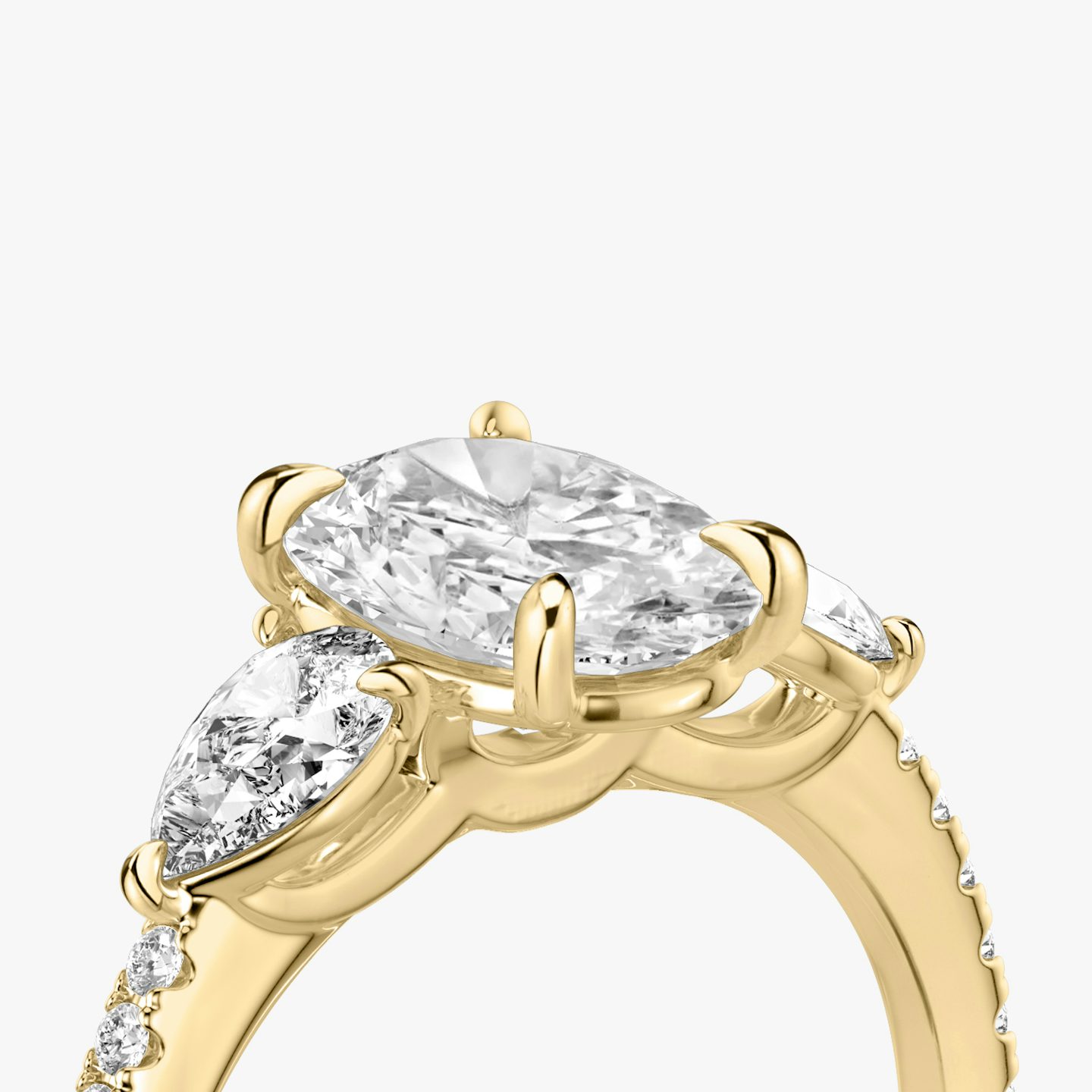 The Three Stone | Oval | 18k | 18k Yellow Gold | Band: Pavé | Side stone carat: 1/4 | Side stone shape: Pear | Diamond orientation: vertical | Carat weight: See full inventory