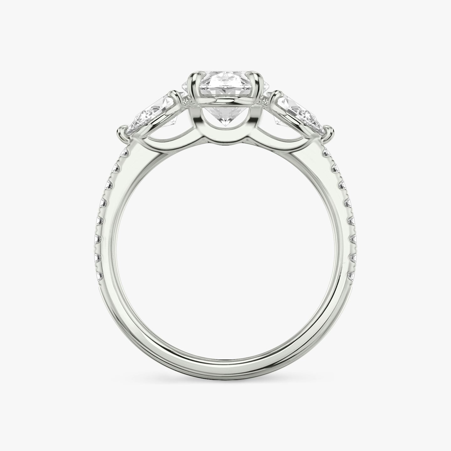 The Three Stone | Oval | Platinum | Band: Pavé | Side stone carat: 1/4 | Side stone shape: Pear | Diamond orientation: vertical | Carat weight: See full inventory