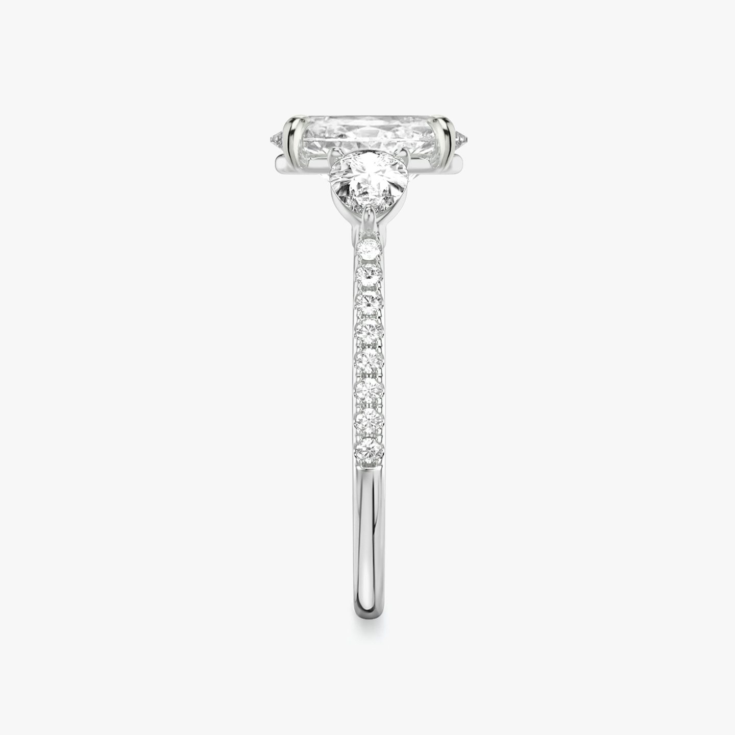 The Three Stone | Oval | Platinum | Band: Pavé | Side stone carat: 1/4 | Side stone shape: Pear | Diamond orientation: vertical | Carat weight: See full inventory