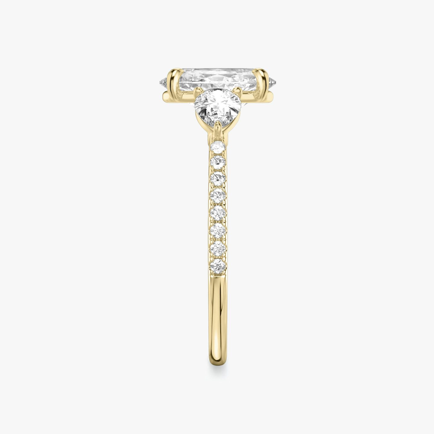 The Three Stone | Oval | 18k | 18k Yellow Gold | Band: Pavé | Side stone carat: 1/4 | Side stone shape: Pear | Diamond orientation: vertical | Carat weight: See full inventory