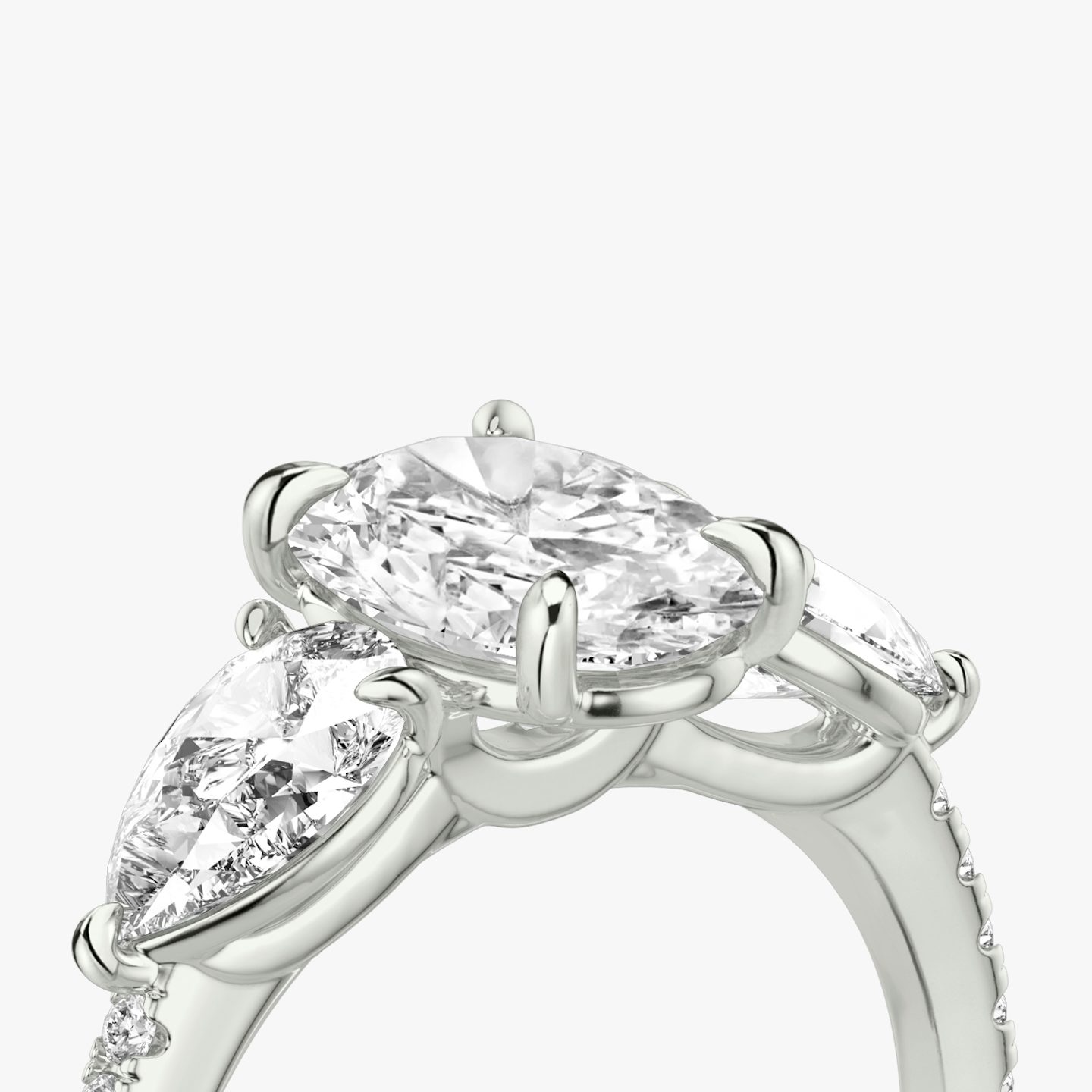 The Three Stone | Oval | 18k | 18k White Gold | Band: Pavé | Side stone carat: 1/2 | Side stone shape: Pear | Diamond orientation: vertical | Carat weight: See full inventory