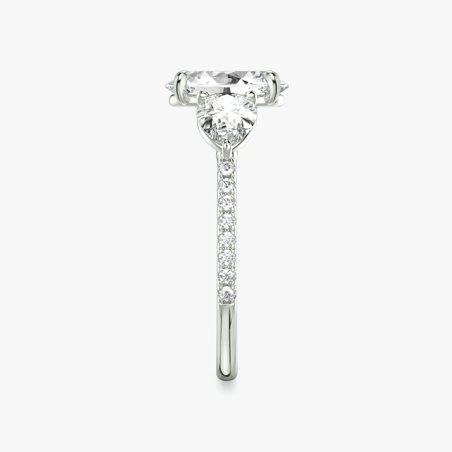 The Three Stone | Oval | Platinum | Band: Pavé | Side stone carat: 1/2 | Side stone shape: Pear | Diamond orientation: vertical | Carat weight: See full inventory