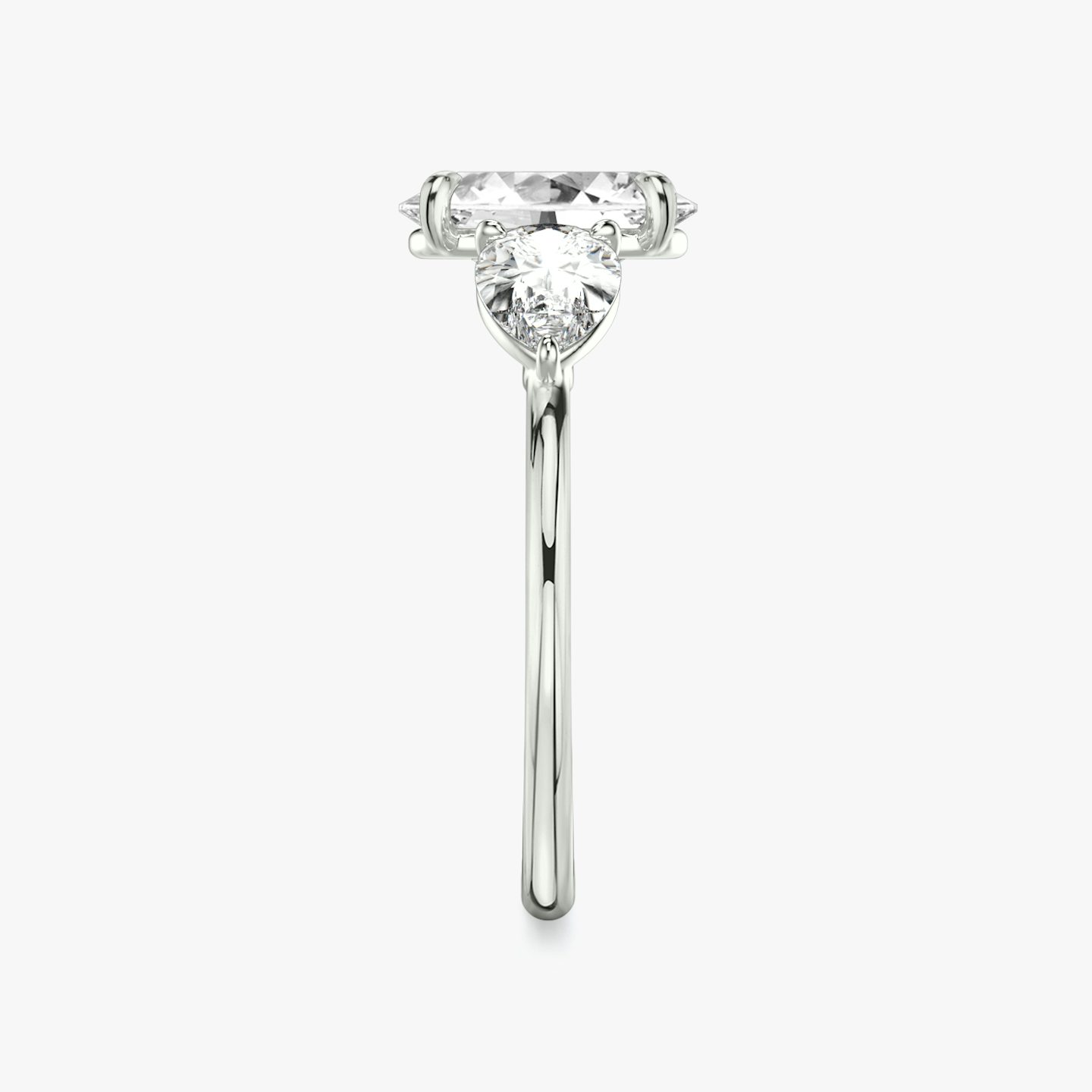 The Three Stone | Oval | 18k | 18k White Gold | Band: Plain | Side stone carat: 1/2 | Side stone shape: Pear | Diamond orientation: vertical | Carat weight: See full inventory