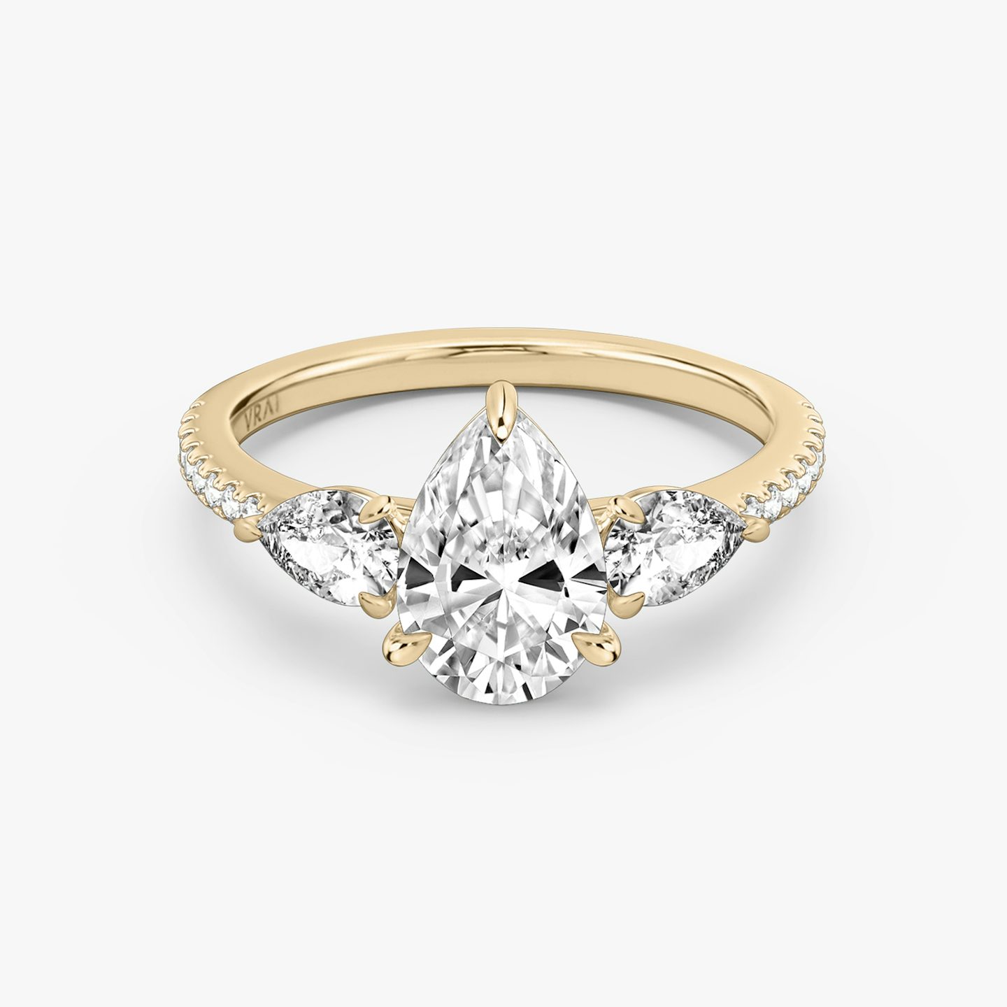 The Three Stone | Pear | 14k | 14k Rose Gold | Band: Pavé | Side stone carat: 1/4 | Side stone shape: Pear | Diamond orientation: vertical | Carat weight: See full inventory