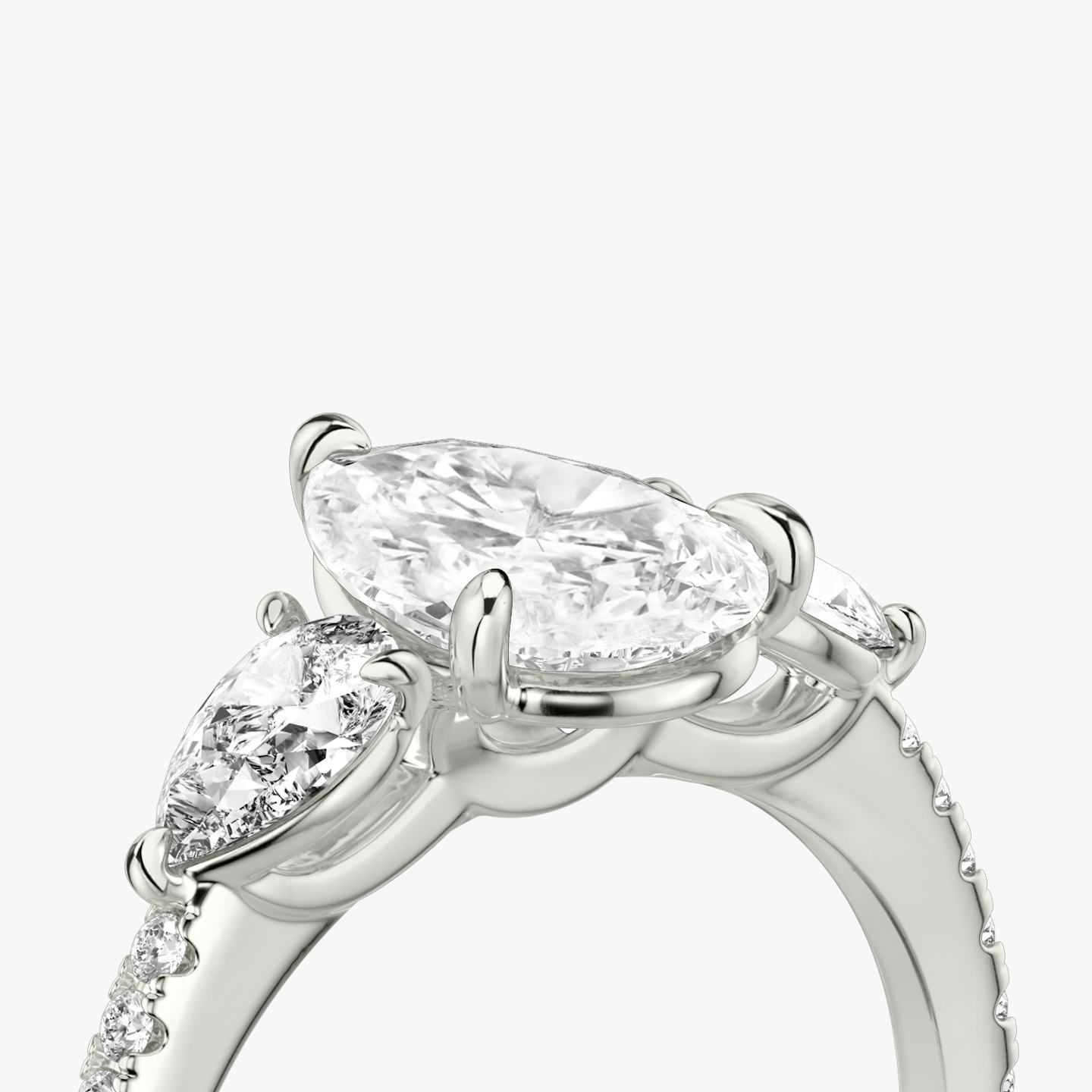 The Three Stone | Pear | Platinum | Band: Pavé | Side stone carat: 1/4 | Side stone shape: Pear | Diamond orientation: vertical | Carat weight: See full inventory