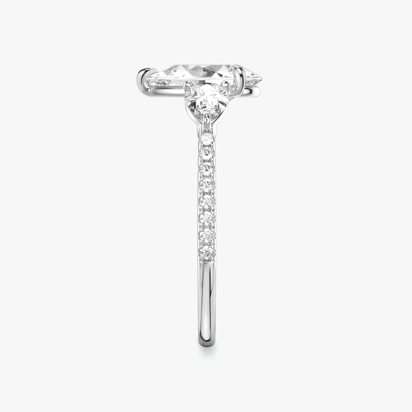 The Three Stone | Pear | 18k | 18k White Gold | Band: Pavé | Side stone carat: 1/4 | Side stone shape: Pear | Diamond orientation: vertical | Carat weight: See full inventory