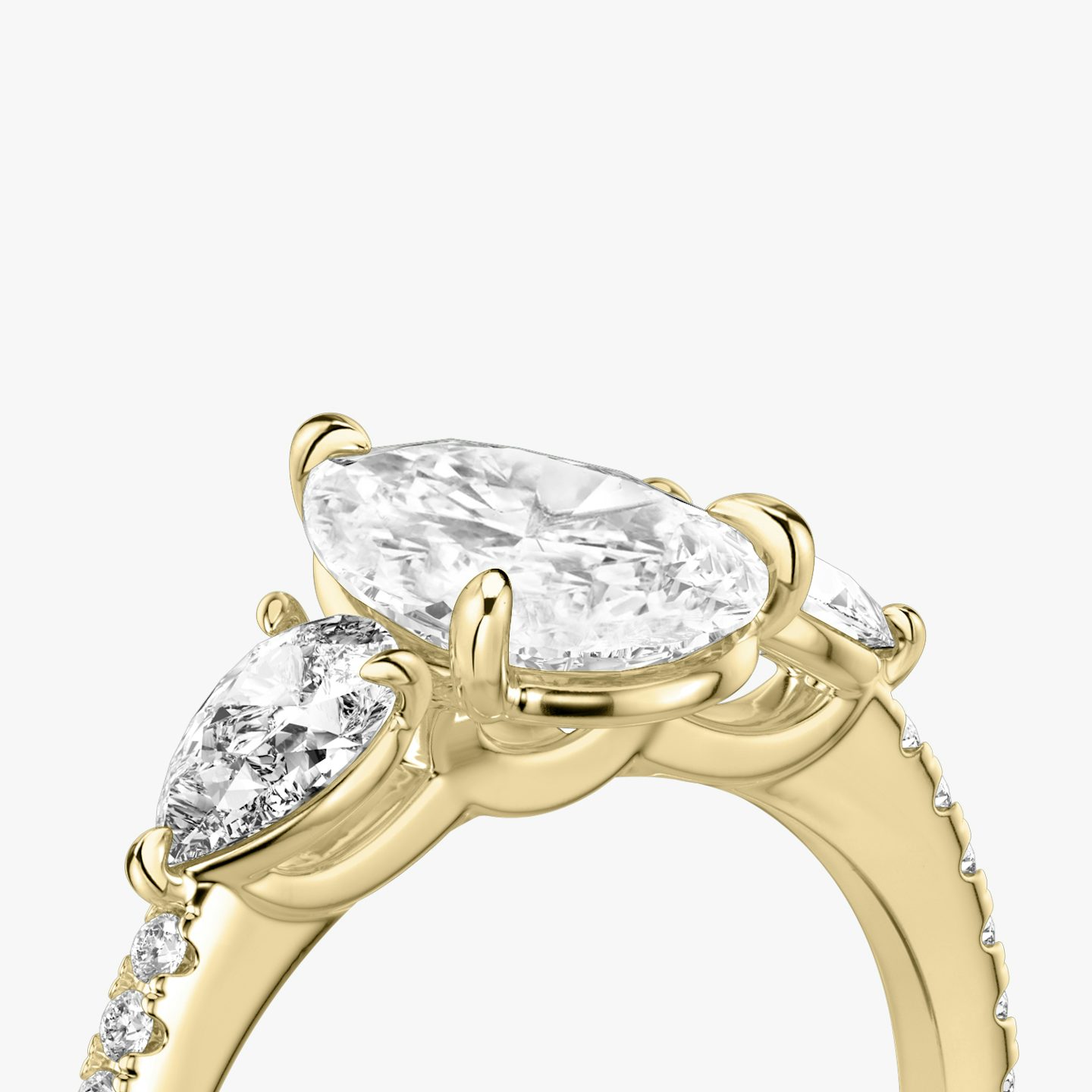 The Three Stone | Pear | 18k | 18k Yellow Gold | Band: Pavé | Side stone carat: 1/4 | Side stone shape: Pear | Diamond orientation: vertical | Carat weight: See full inventory