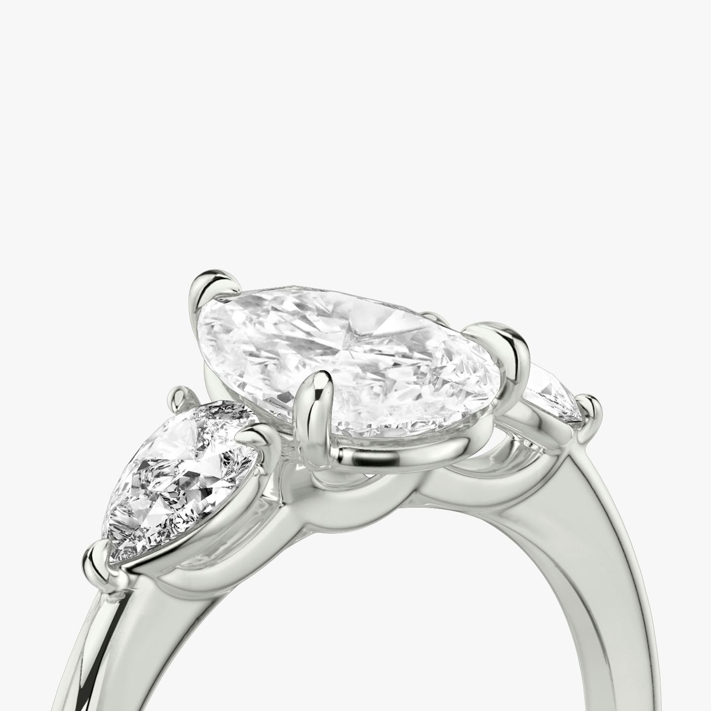 The Three Stone | Pear | 18k | 18k White Gold | Band: Plain | Side stone carat: 1/4 | Side stone shape: Pear | Diamond orientation: vertical | Carat weight: See full inventory