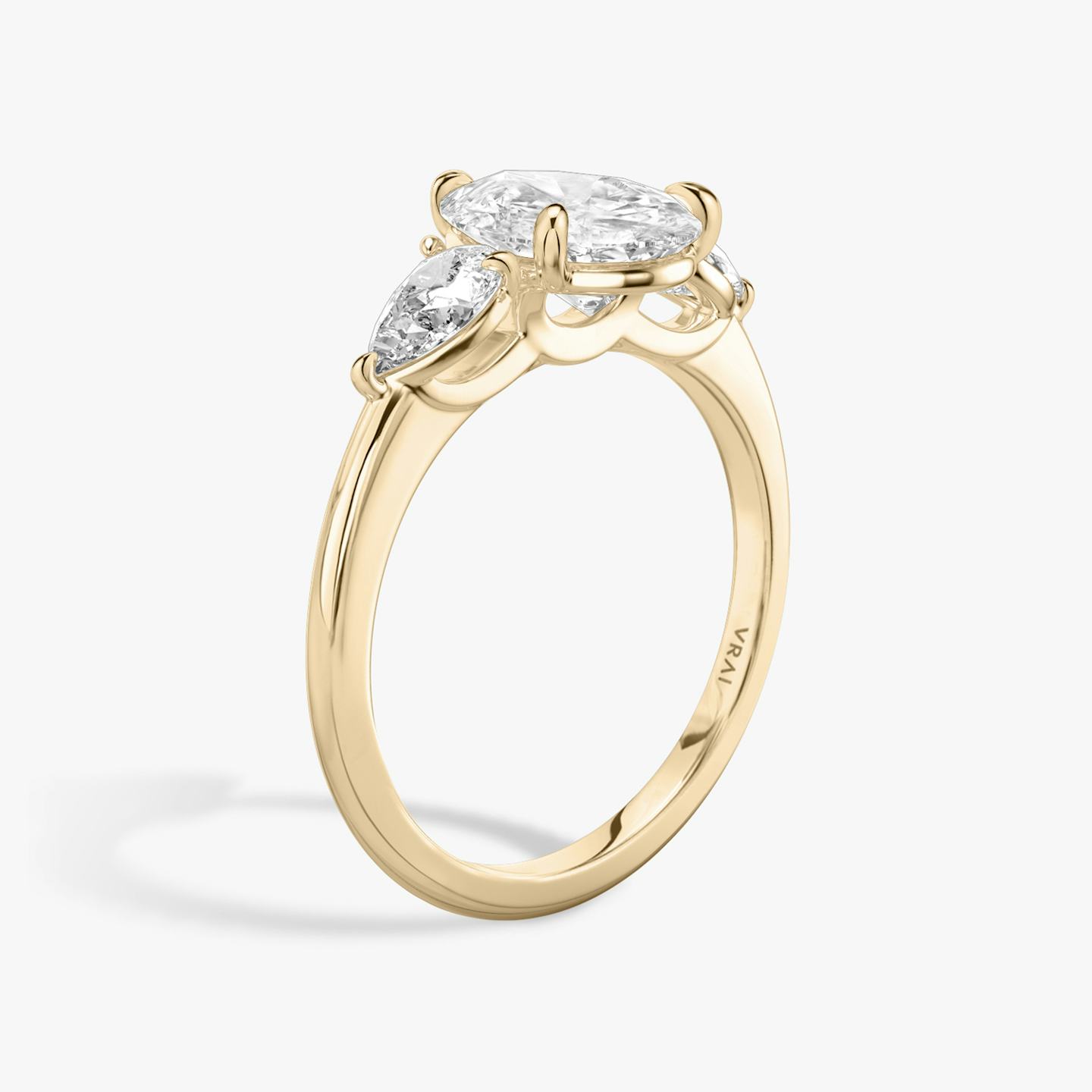 The Three Stone | Pear | 14k | 14k Rose Gold | Band: Plain | Side stone carat: 1/4 | Side stone shape: Pear | Diamond orientation: vertical | Carat weight: See full inventory