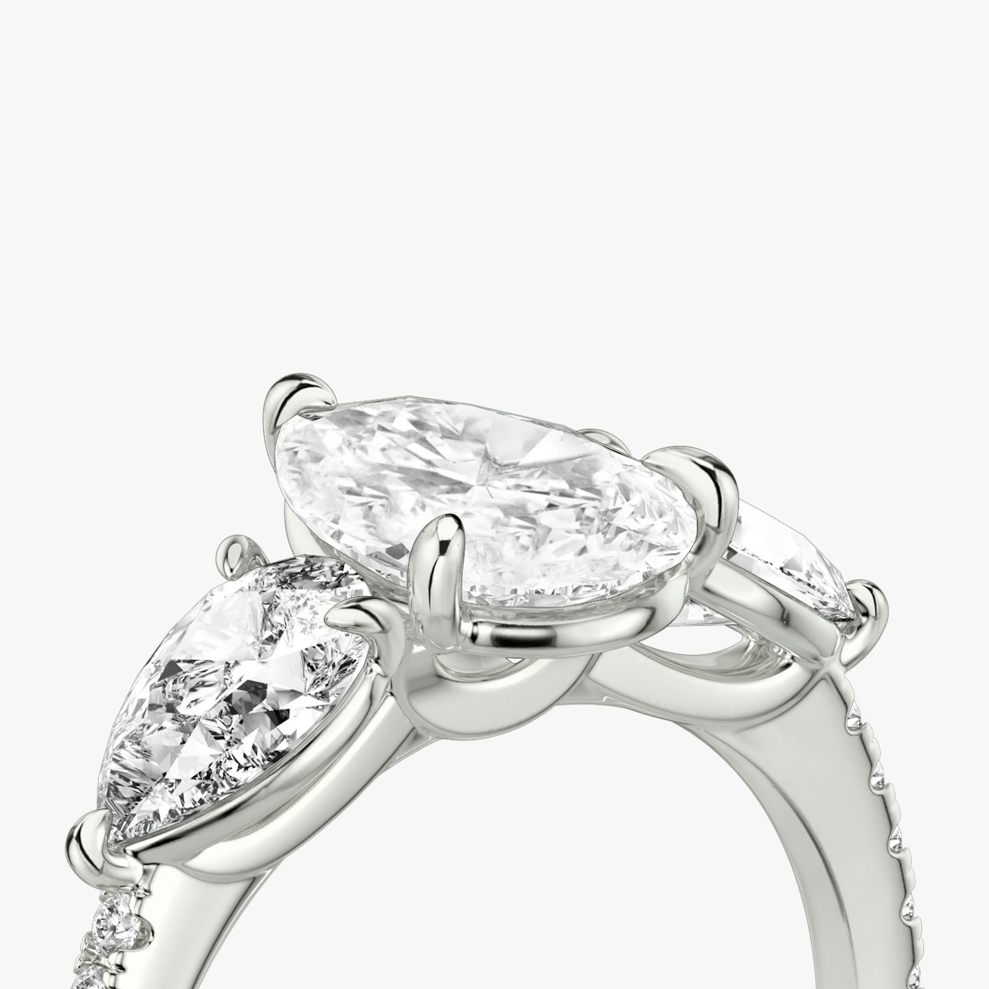 The Three Stone | Pear | 18k | 18k White Gold | Band: Pavé | Side stone carat: 1/2 | Side stone shape: Pear | Diamond orientation: vertical | Carat weight: See full inventory