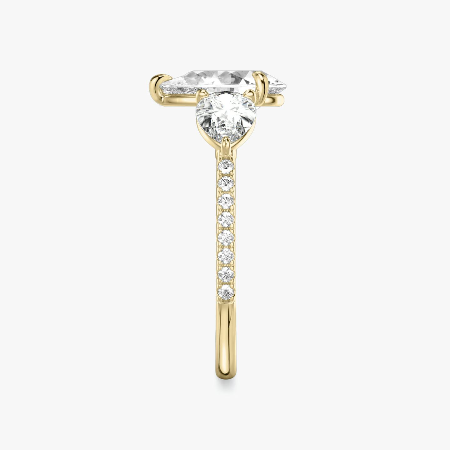 The Three Stone | Pear | 18k | 18k Yellow Gold | Band: Pavé | Side stone carat: 1/2 | Side stone shape: Pear | Diamond orientation: vertical | Carat weight: See full inventory