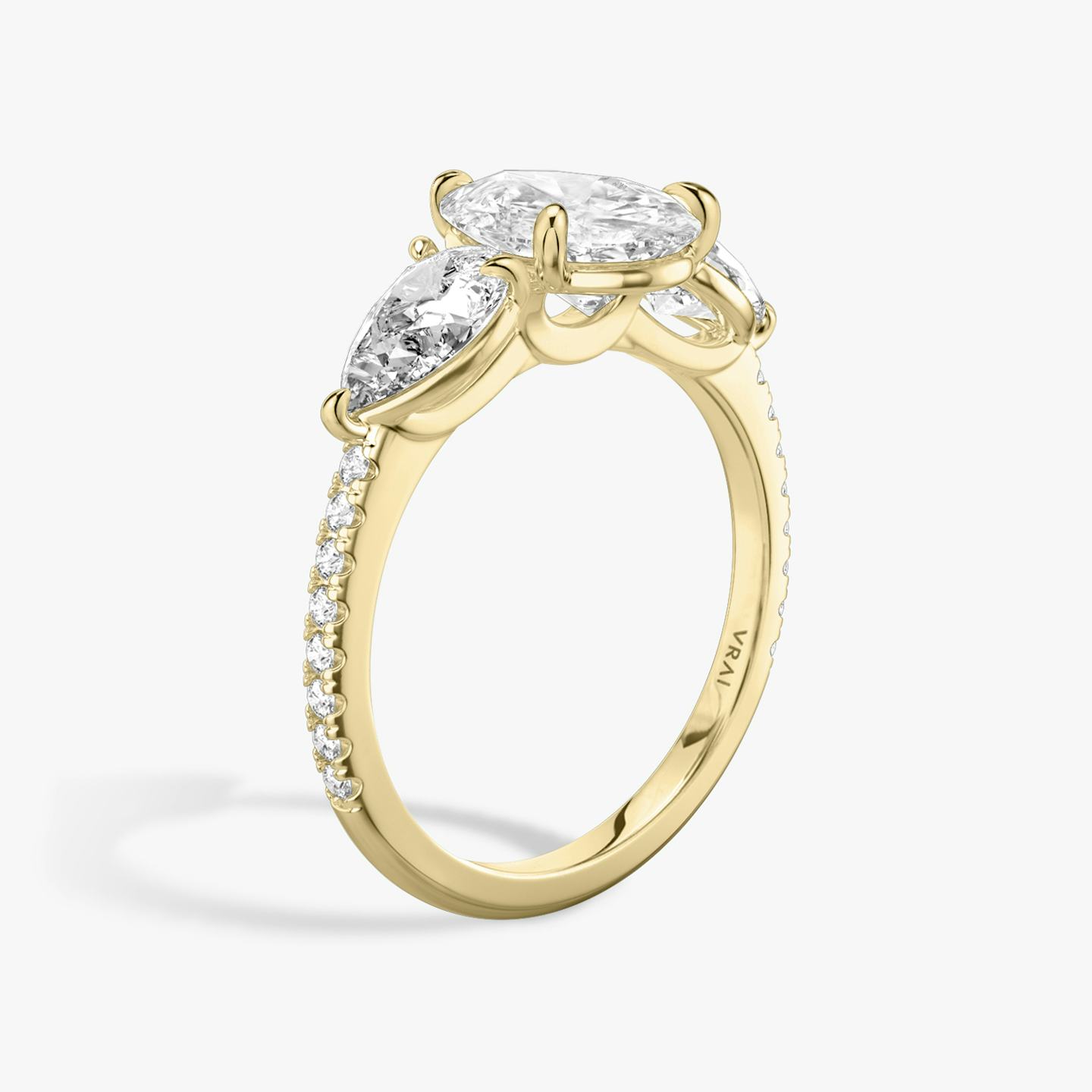 The Three Stone | Pear | 18k | 18k Yellow Gold | Band: Pavé | Side stone carat: 1/2 | Side stone shape: Pear | Diamond orientation: vertical | Carat weight: See full inventory