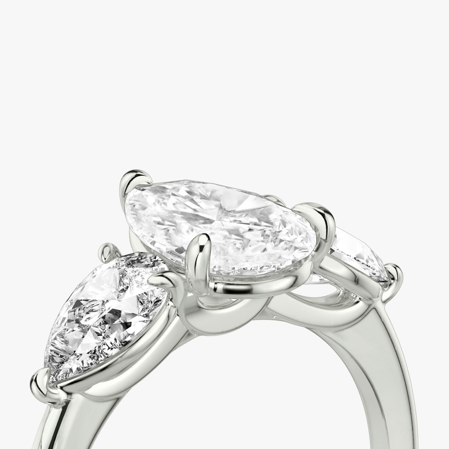 The Three Stone | Pear | Platinum | Band: Plain | Side stone carat: 1/2 | Side stone shape: Pear | Diamond orientation: vertical | Carat weight: See full inventory