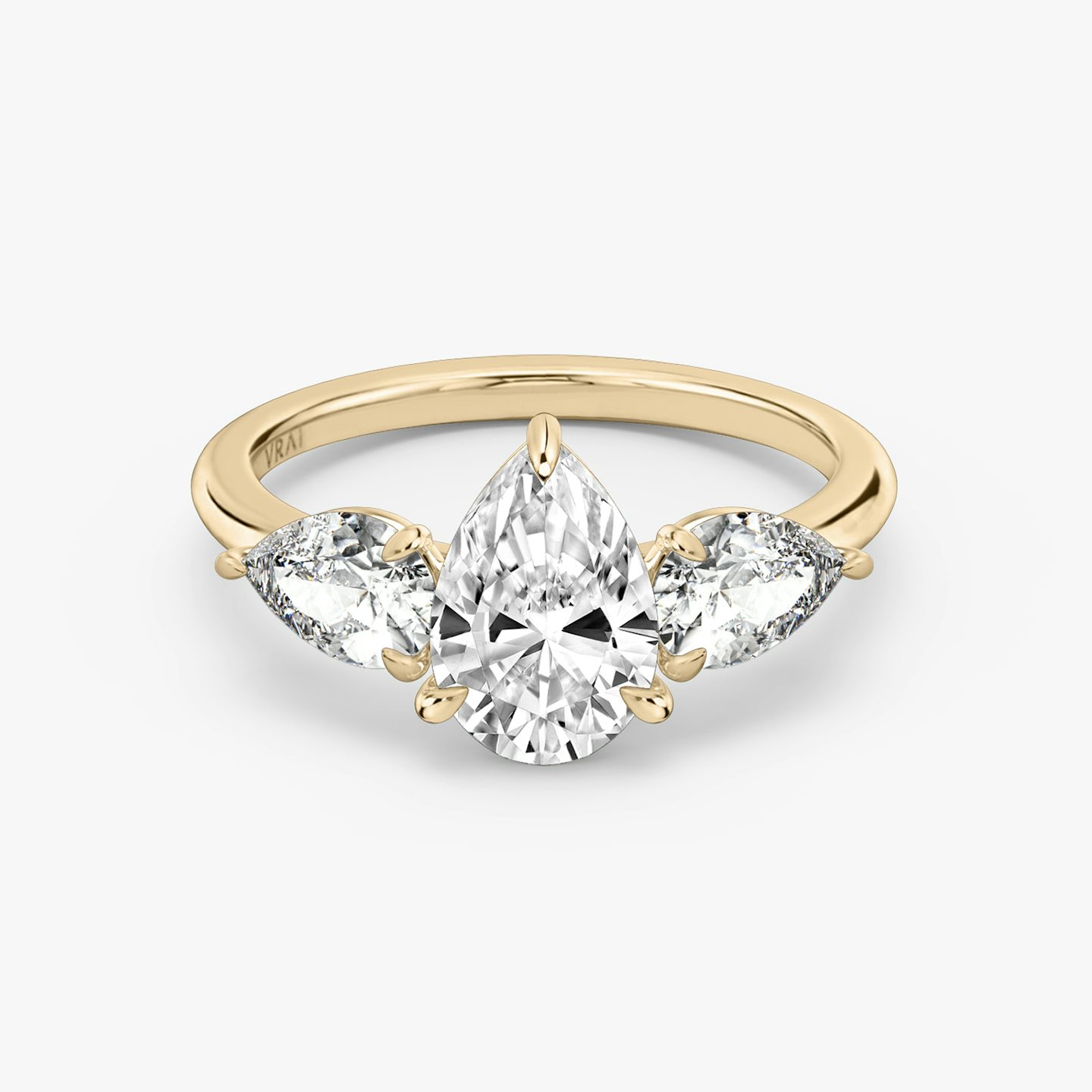 The Three Stone | Pear | 14k | 14k Rose Gold | Band: Plain | Side stone carat: 1/2 | Side stone shape: Pear | Diamond orientation: vertical | Carat weight: See full inventory