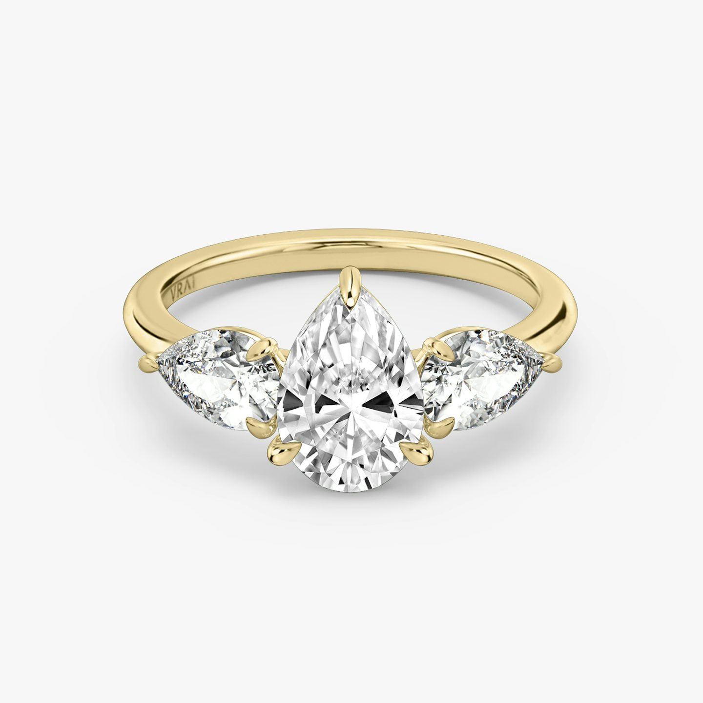 The Three Stone | Pear | 18k | 18k Yellow Gold | Band: Plain | Side stone carat: 1/2 | Side stone shape: Pear | Diamond orientation: vertical | Carat weight: See full inventory