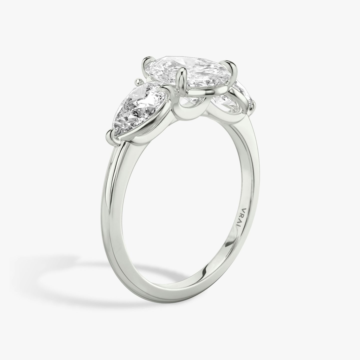 The Three Stone | Pear | 18k | 18k White Gold | Band: Plain | Side stone carat: 1/2 | Side stone shape: Pear | Diamond orientation: vertical | Carat weight: See full inventory