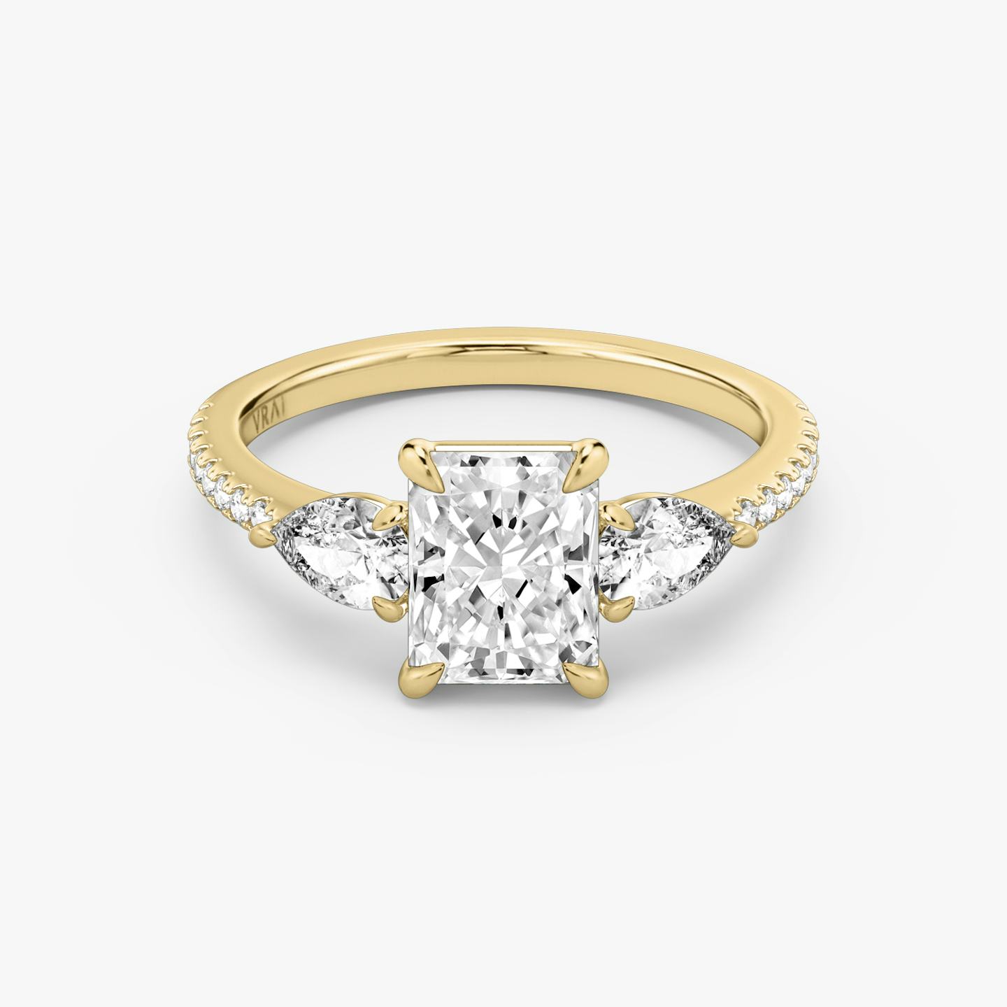 The Three Stone | Radiant | 18k | 18k Yellow Gold | Band: Pavé | Side stone carat: 1/4 | Side stone shape: Pear | Diamond orientation: vertical | Carat weight: See full inventory