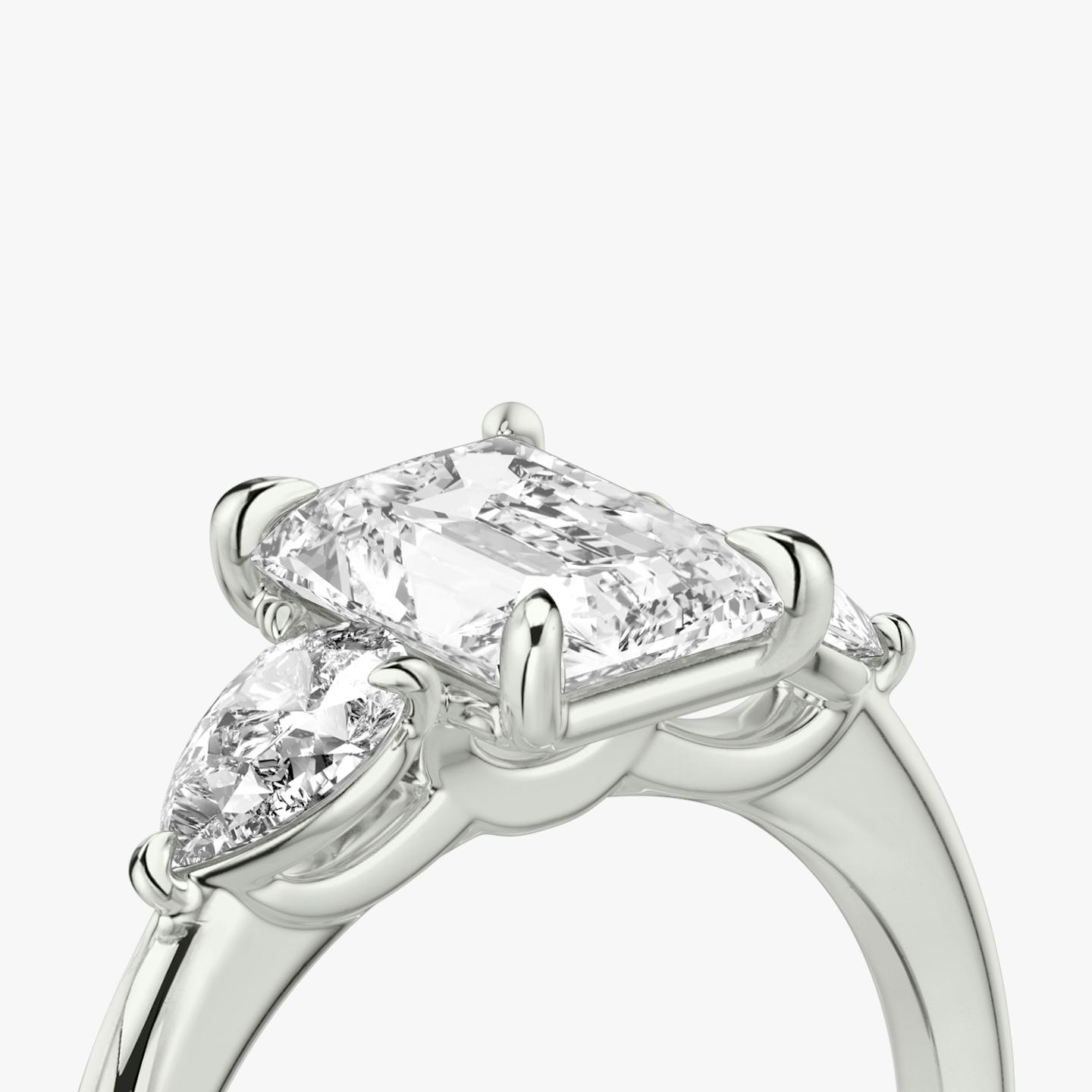 The Three Stone | Radiant | Platinum | Band: Plain | Side stone carat: 1/4 | Side stone shape: Pear | Diamond orientation: vertical | Carat weight: See full inventory