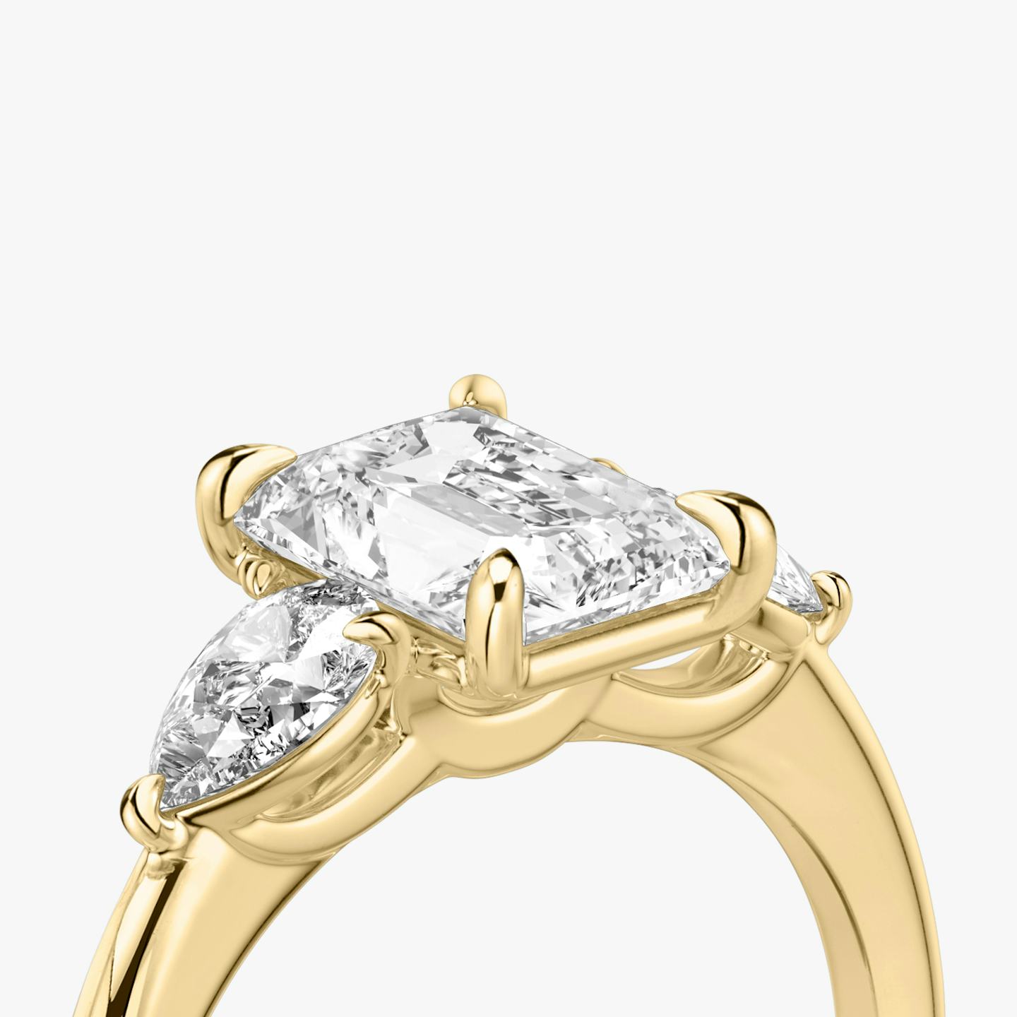 The Three Stone | Radiant | 18k | 18k Yellow Gold | Band: Plain | Side stone carat: 1/4 | Side stone shape: Pear | Diamond orientation: vertical | Carat weight: See full inventory