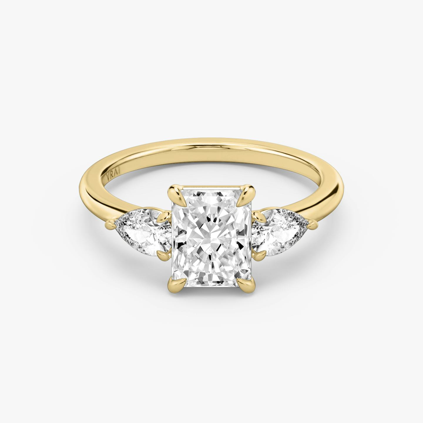 The Three Stone | Radiant | 18k | 18k Yellow Gold | Band: Plain | Side stone carat: 1/4 | Side stone shape: Pear | Diamond orientation: vertical | Carat weight: See full inventory