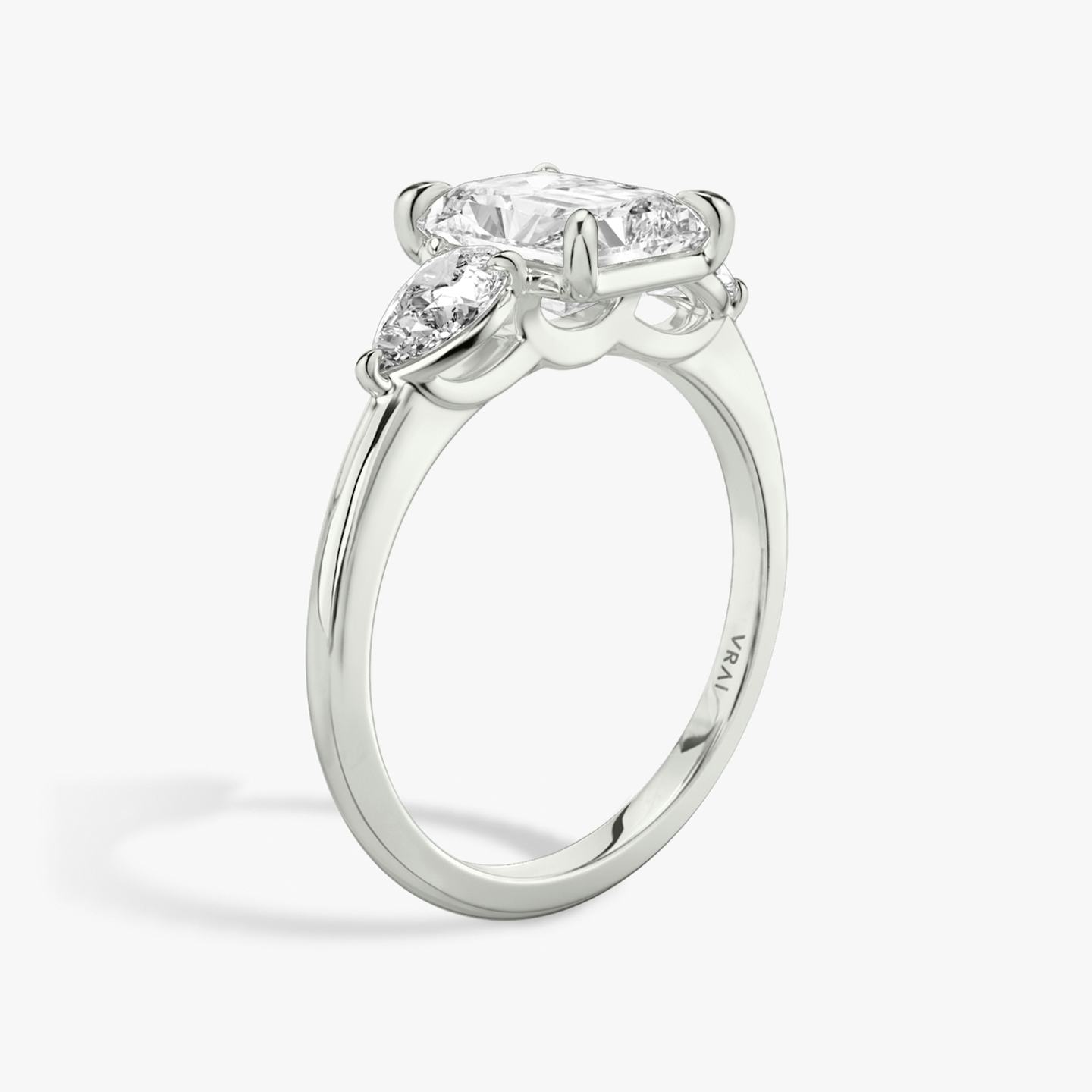 The Three Stone | Radiant | 18k | 18k White Gold | Band: Plain | Side stone carat: 1/4 | Side stone shape: Pear | Diamond orientation: vertical | Carat weight: See full inventory