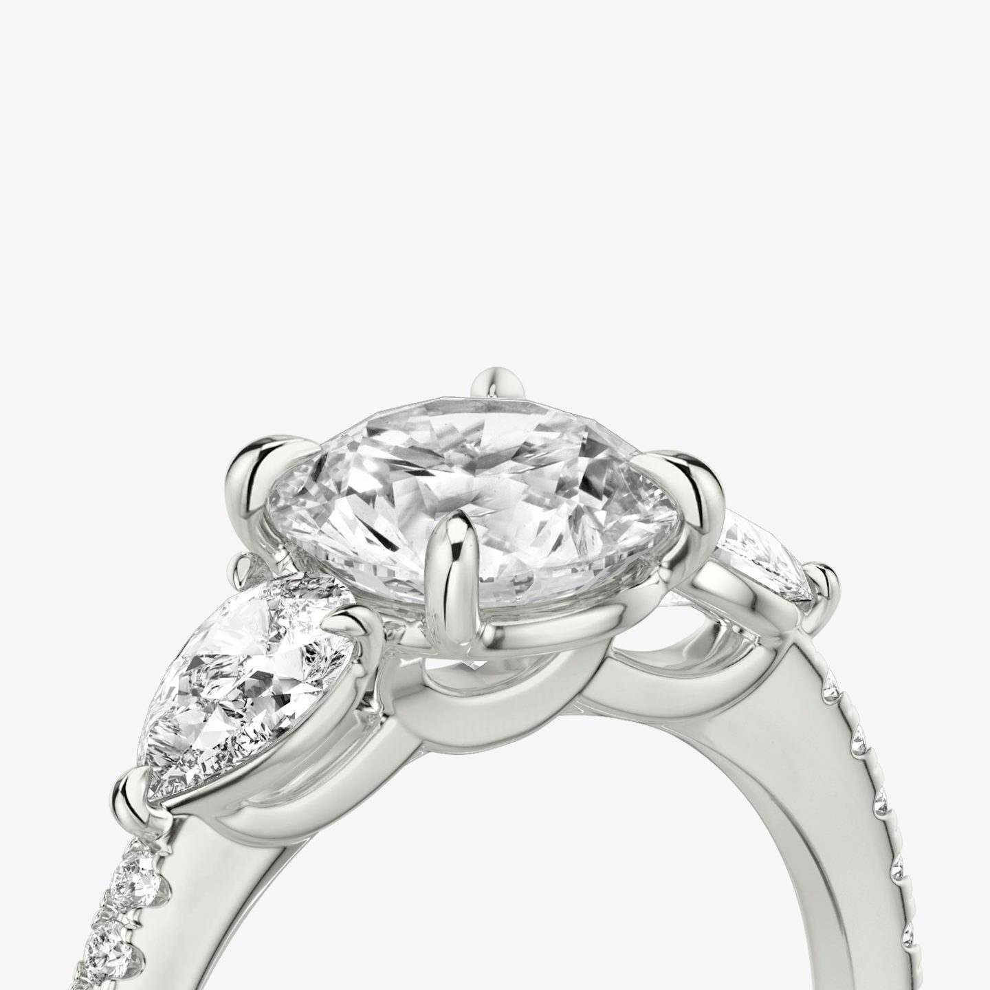 The Three Stone | Round Brilliant | 18k | 18k White Gold | Band: Pavé | Carat weight: See full inventory | Side stone carat: 1/4 | Side stone shape: Pear | Diamond orientation: vertical