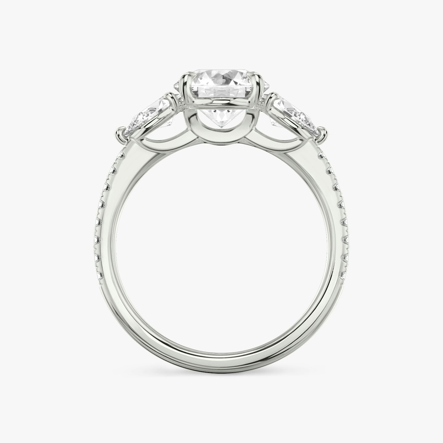 The Three Stone | Round Brilliant | 18k | 18k White Gold | Band: Pavé | Carat weight: See full inventory | Side stone carat: 1/4 | Side stone shape: Pear | Diamond orientation: vertical