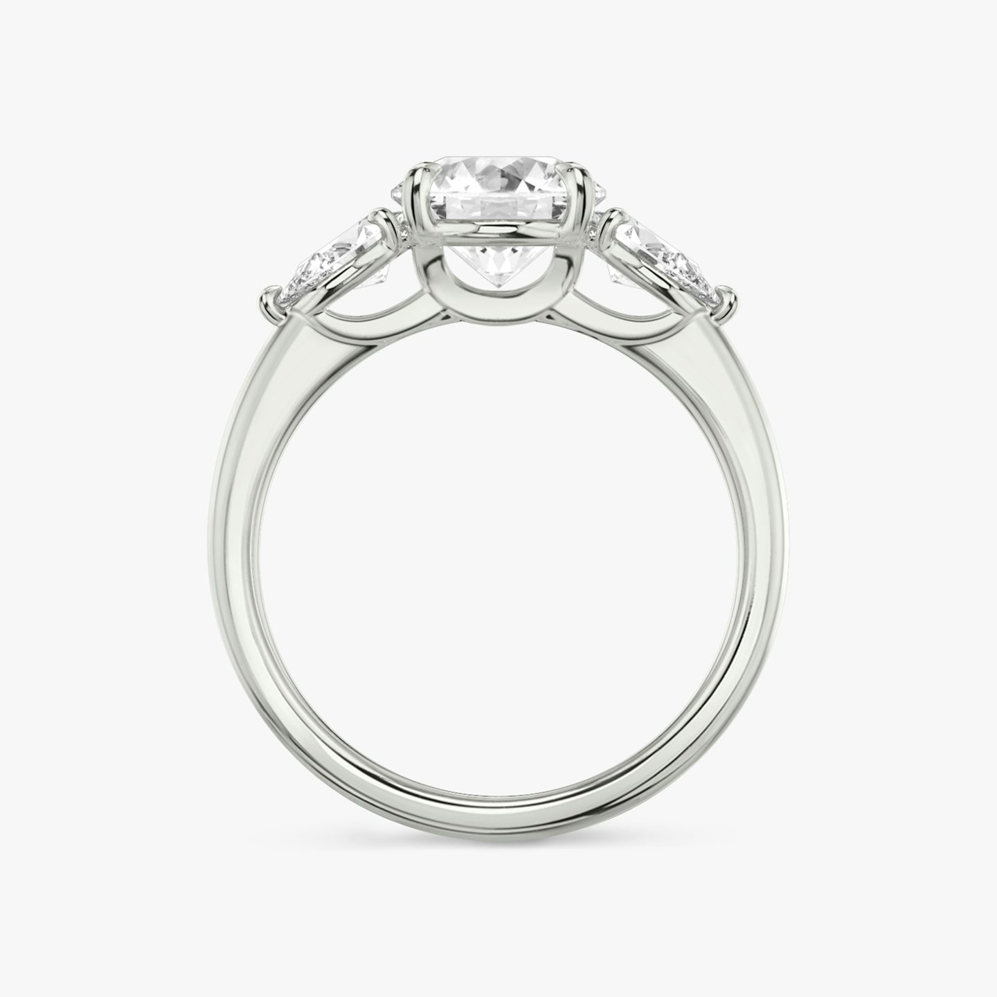 The Three Stone | Round Brilliant | Platinum | Band: Plain | Carat weight: See full inventory | Side stone carat: 1/4 | Side stone shape: Pear | Diamond orientation: vertical