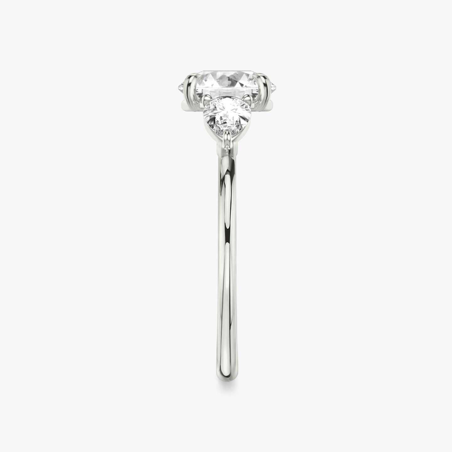 The Three Stone | Round Brilliant | Platinum | Band: Plain | Carat weight: See full inventory | Side stone carat: 1/4 | Side stone shape: Pear | Diamond orientation: vertical