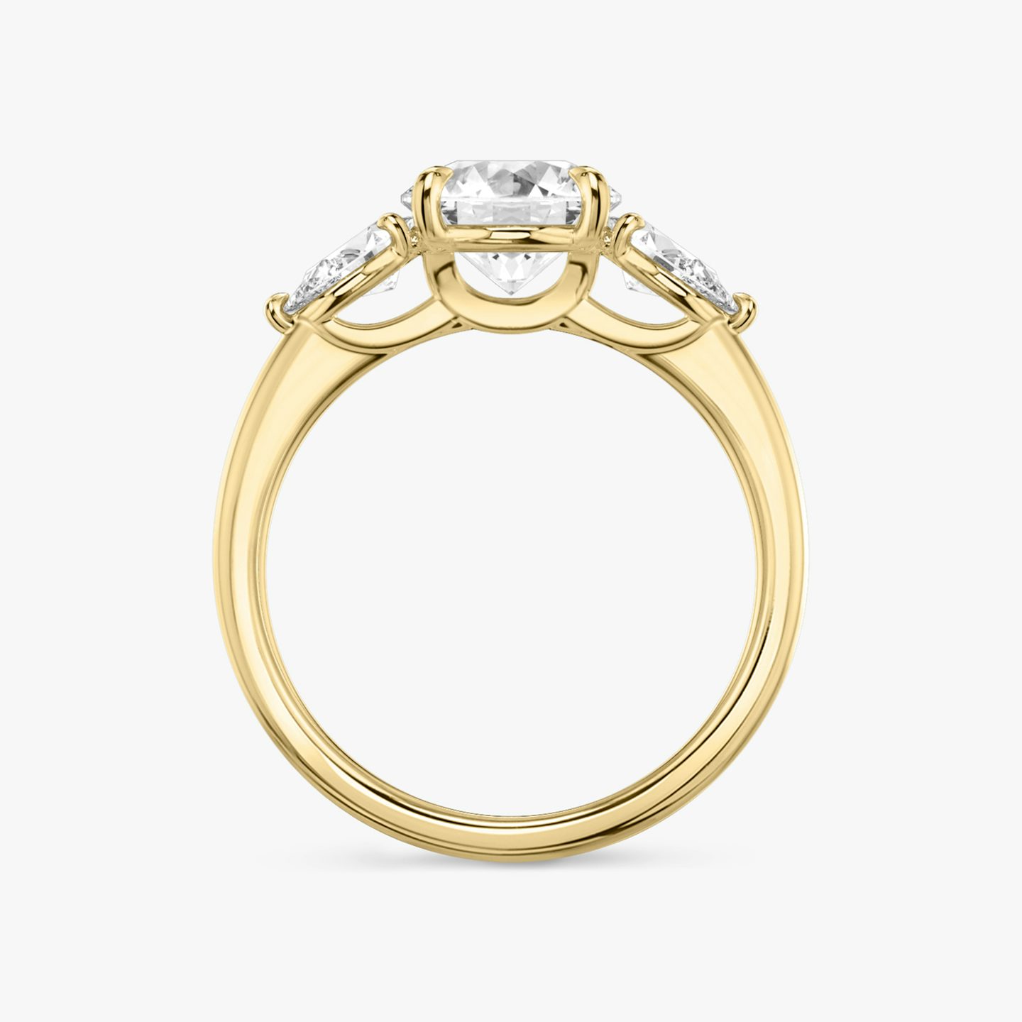The Three Stone | Round Brilliant | 18k | 18k Yellow Gold | Band: Plain | Carat weight: See full inventory | Side stone carat: 1/4 | Side stone shape: Pear | Diamond orientation: vertical