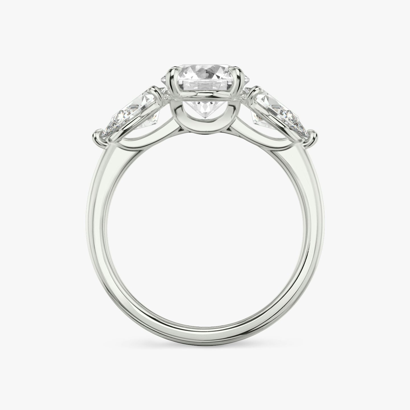 The Three Stone | Round Brilliant | 18k | 18k White Gold | Band: Plain | Carat weight: See full inventory | Side stone carat: 1/2 | Side stone shape: Pear | Diamond orientation: vertical