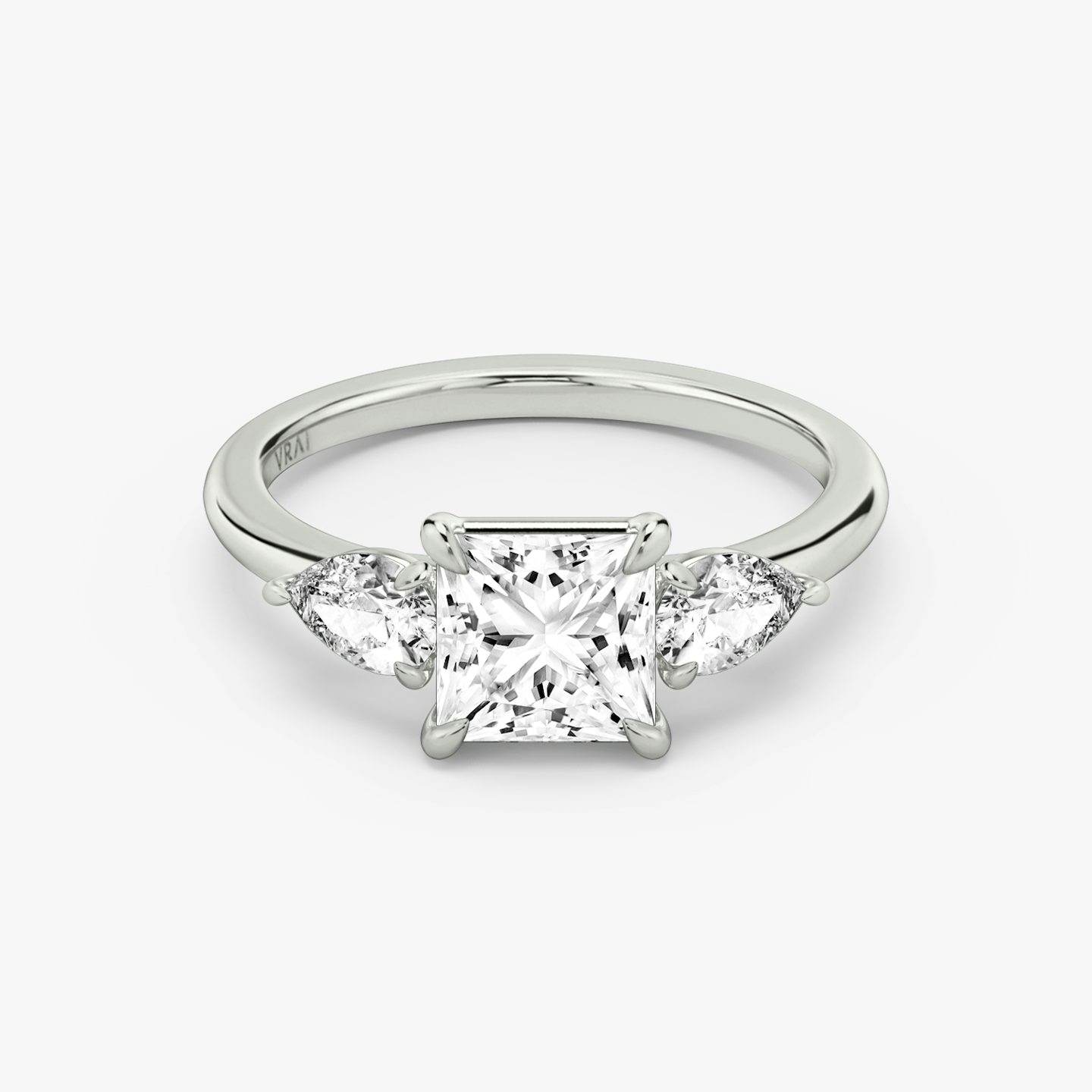 The Three Stone | Princess | 18k | 18k White Gold | Band: Plain | Side stone carat: 1/4 | Side stone shape: Pear | Diamond orientation: vertical | Carat weight: See full inventory