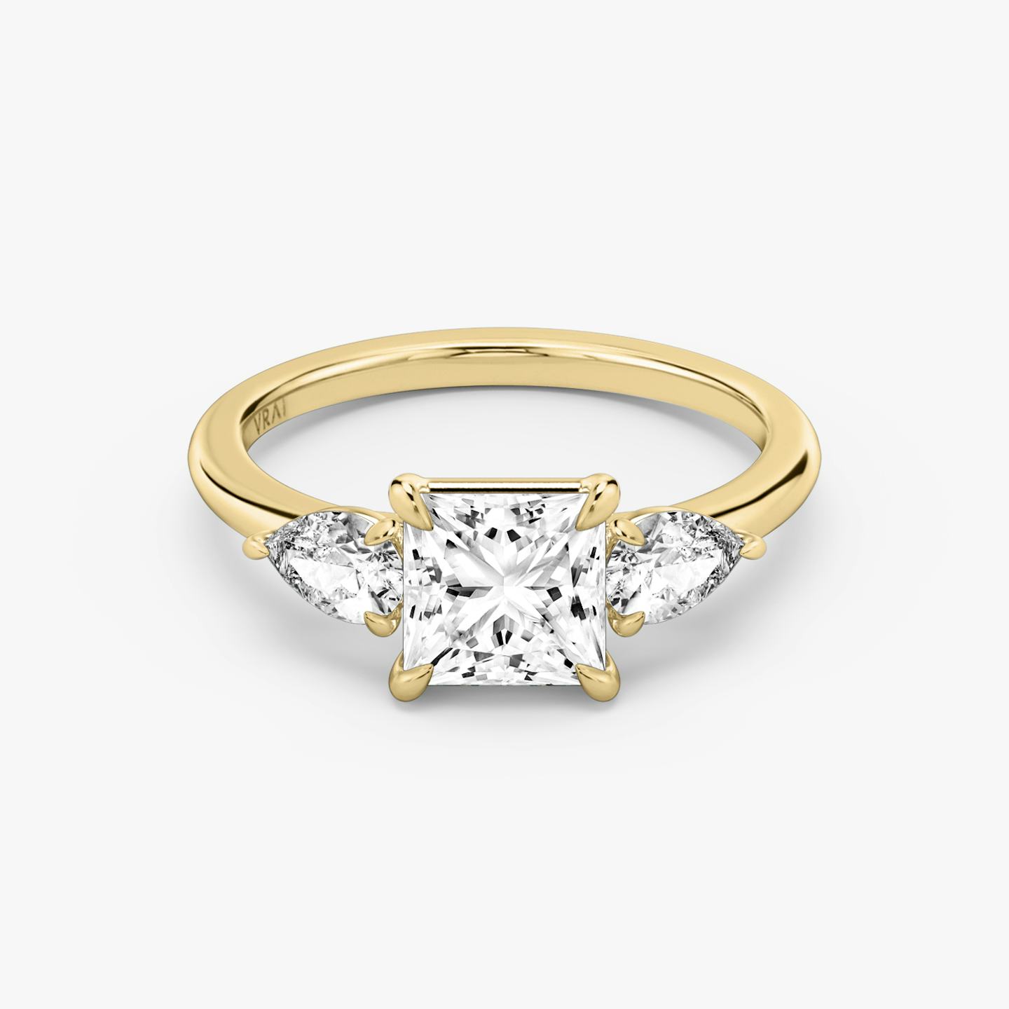 The Three Stone | Princess | 18k | 18k Yellow Gold | Band: Plain | Side stone carat: 1/4 | Side stone shape: Pear | Diamond orientation: vertical | Carat weight: See full inventory