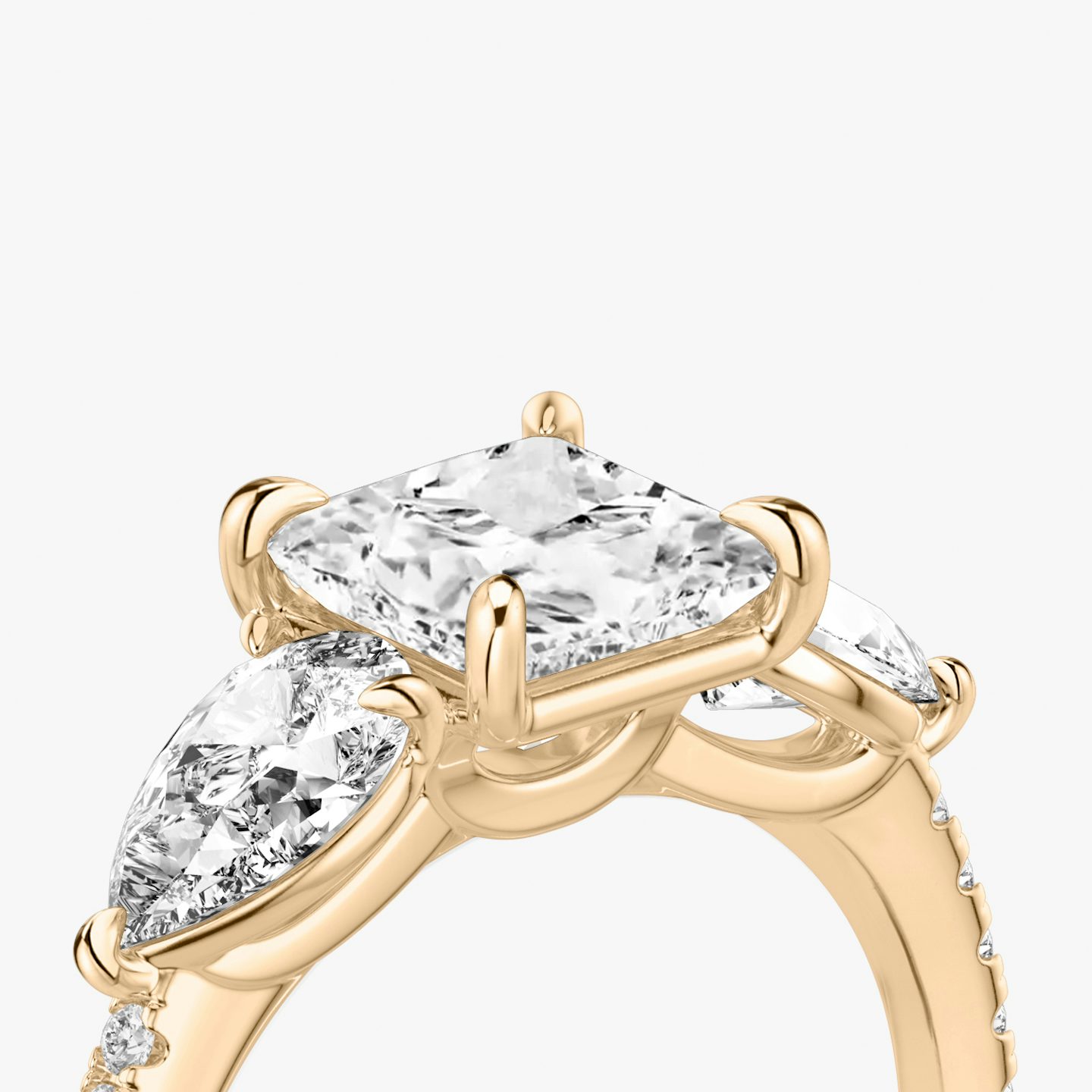 The Three Stone | Princess | 14k | 14k Rose Gold | Band: Pavé | Side stone carat: 1/2 | Side stone shape: Pear | Diamond orientation: vertical | Carat weight: See full inventory