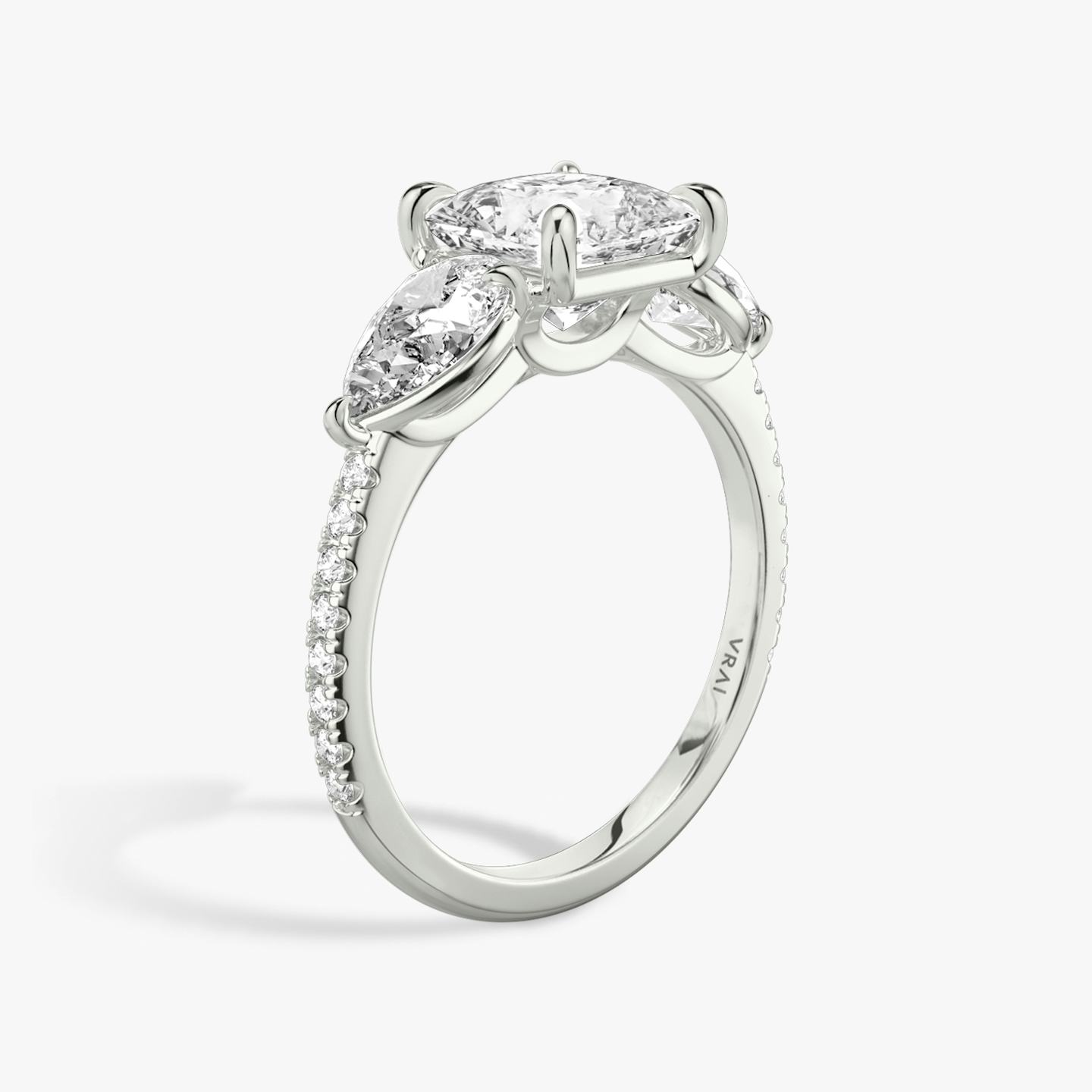 The Three Stone | Princess | Platinum | Band: Pavé | Side stone carat: 1/2 | Side stone shape: Pear | Diamond orientation: vertical | Carat weight: See full inventory