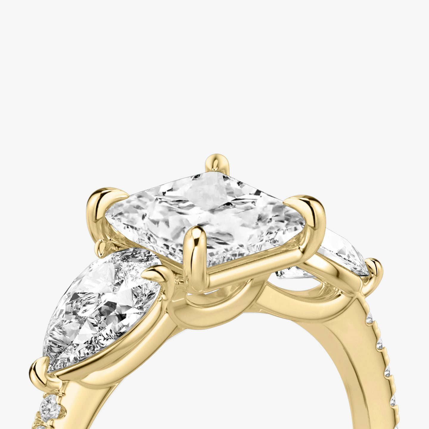 The Three Stone | Princess | 18k | 18k Yellow Gold | Band: Pavé | Side stone carat: 1/2 | Side stone shape: Pear | Diamond orientation: vertical | Carat weight: See full inventory