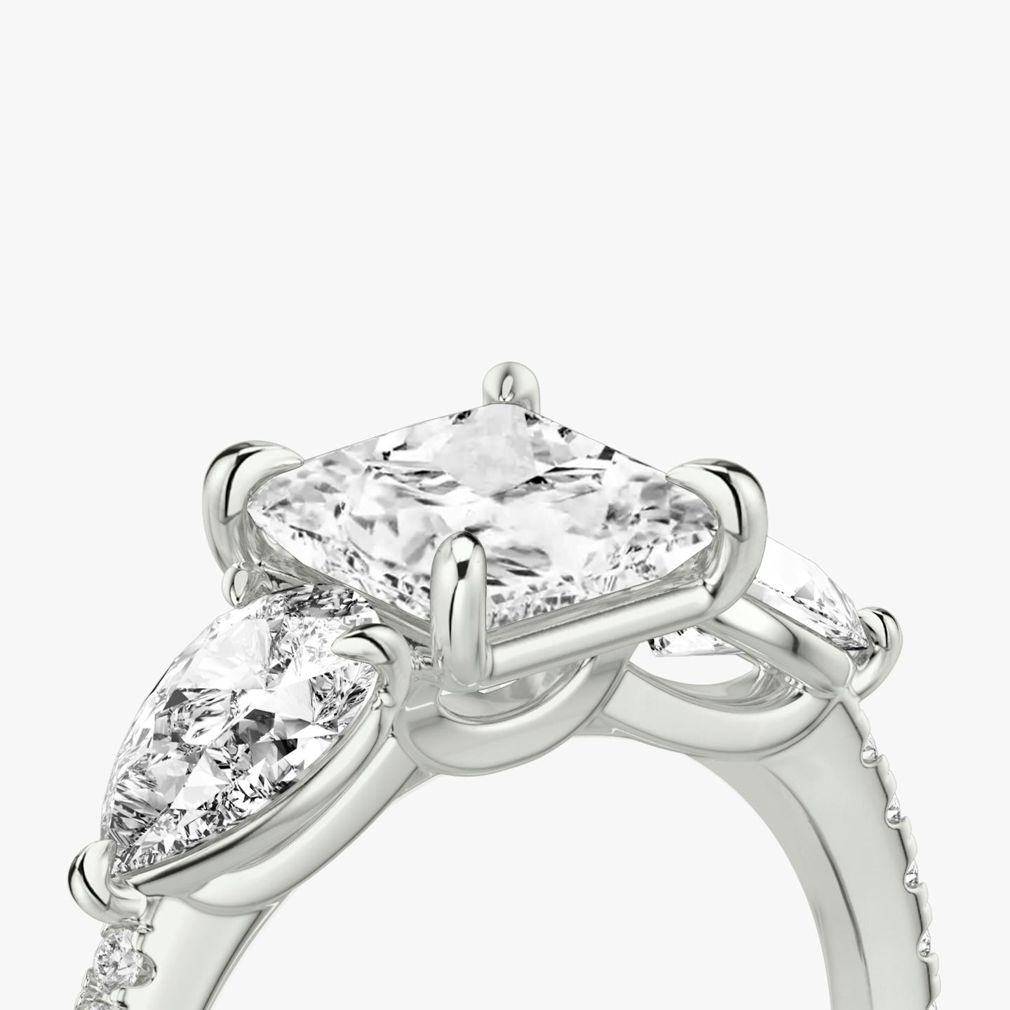 The Three Stone | Princess | Platinum | Band: Pavé | Side stone carat: 1/2 | Side stone shape: Pear | Diamond orientation: vertical | Carat weight: See full inventory