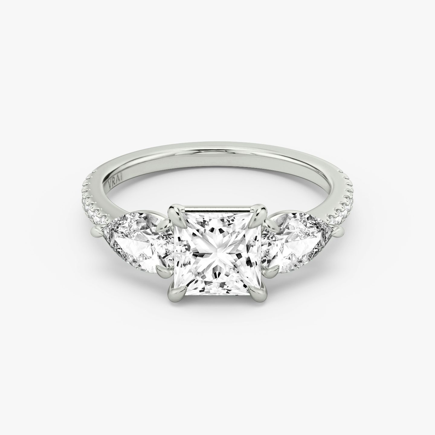 The Three Stone | Princess | 18k | 18k White Gold | Band: Pavé | Side stone carat: 1/2 | Side stone shape: Pear | Diamond orientation: vertical | Carat weight: See full inventory