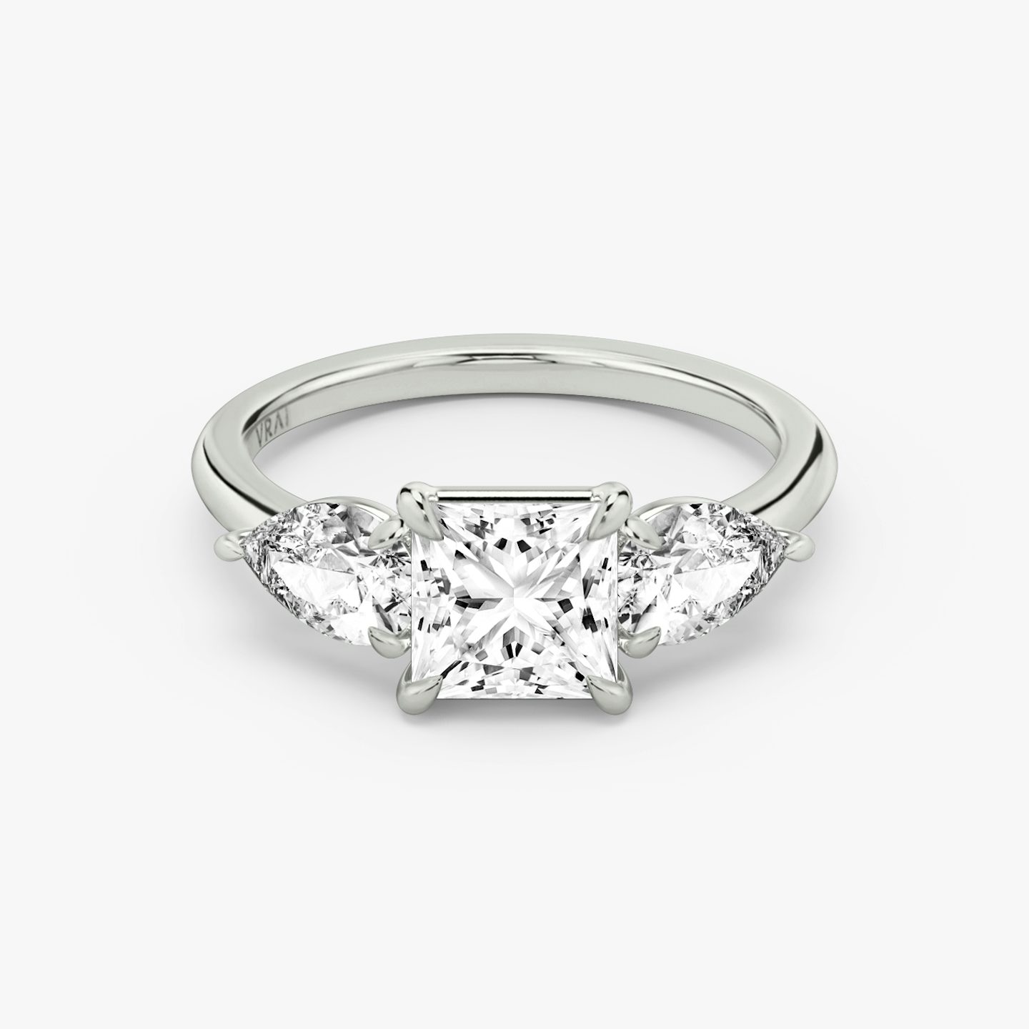 The Three Stone | Princess | 18k | 18k White Gold | Band: Plain | Side stone carat: 1/2 | Side stone shape: Pear | Diamond orientation: vertical | Carat weight: See full inventory