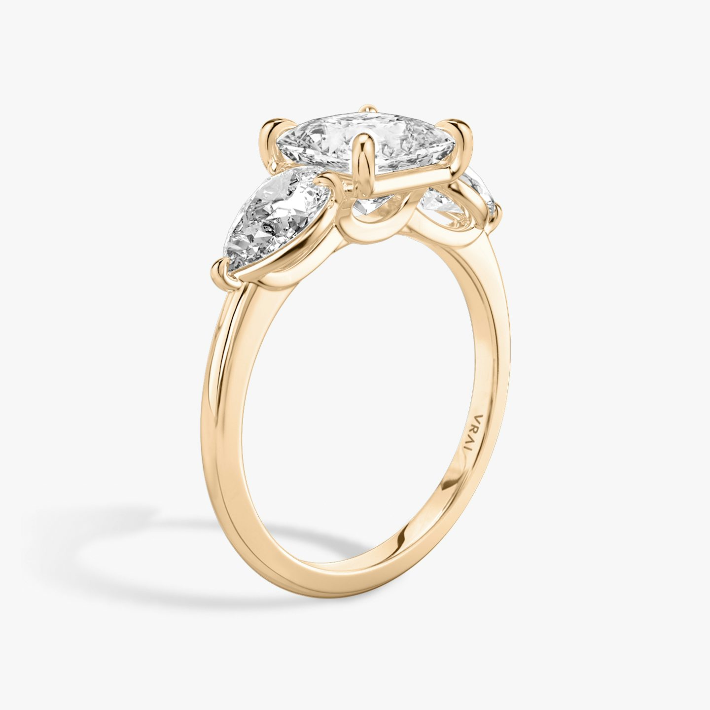 The Three Stone | Princess | 14k | 14k Rose Gold | Band: Plain | Side stone carat: 1/2 | Side stone shape: Pear | Diamond orientation: vertical | Carat weight: See full inventory
