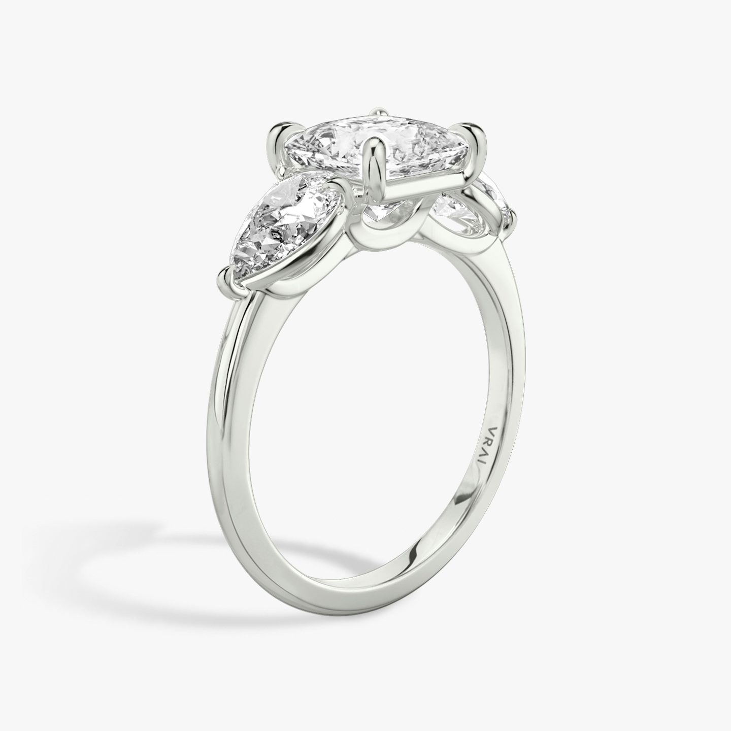 The Three Stone | Princess | 18k | 18k White Gold | Band: Plain | Side stone carat: 1/2 | Side stone shape: Pear | Diamond orientation: vertical | Carat weight: See full inventory