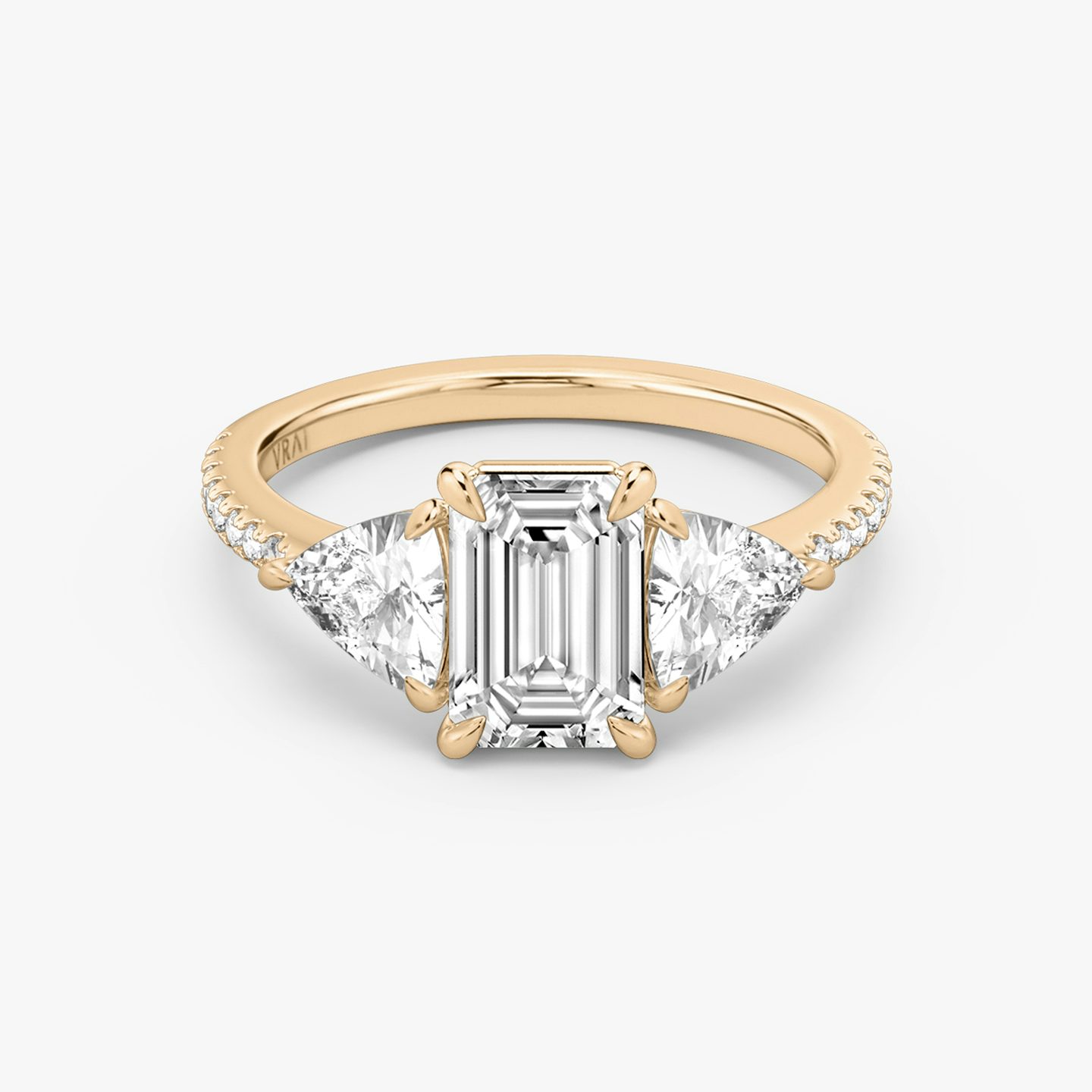 The Three Stone | Emerald | 14k | 14k Rose Gold | Band: Pavé | Side stone carat: 1/2 | Side stone shape: Trillion | Diamond orientation: vertical | Carat weight: See full inventory
