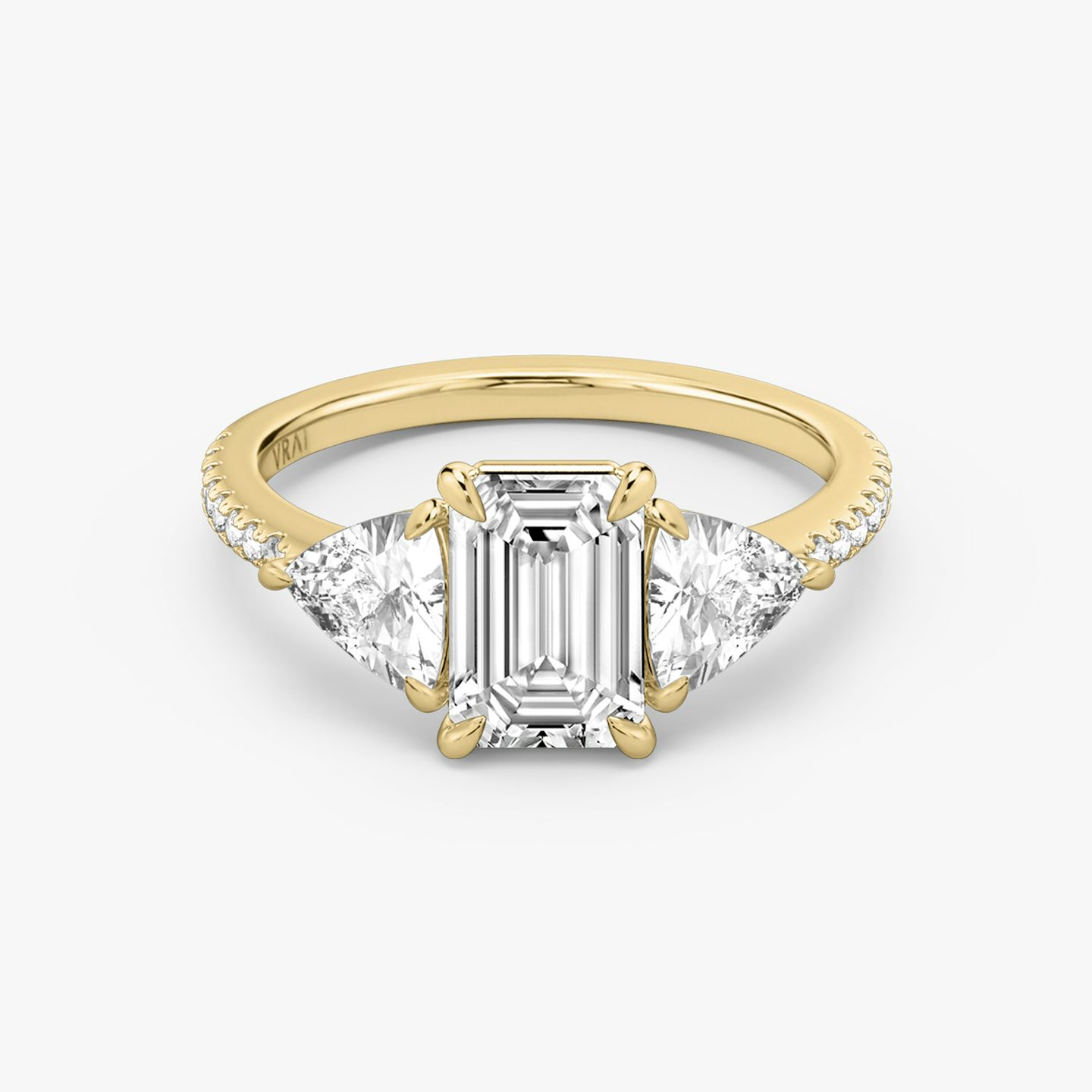The Three Stone | Emerald | 18k | 18k Yellow Gold | Band: Pavé | Side stone carat: 1/2 | Side stone shape: Trillion | Diamond orientation: vertical | Carat weight: See full inventory