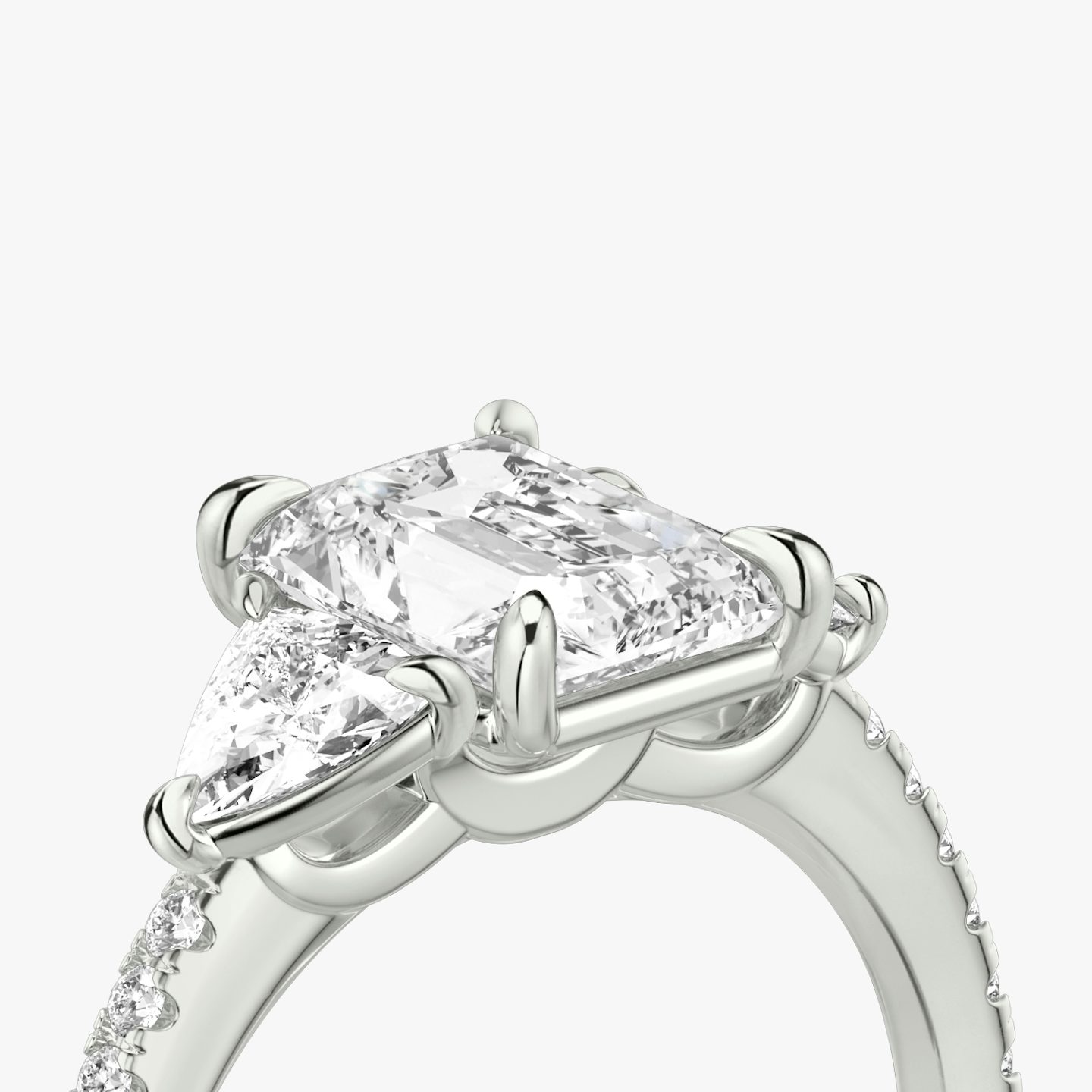 The Three Stone | Radiant | 18k | 18k White Gold | Band: Pavé | Side stone carat: 1/4 | Side stone shape: Trillion | Diamond orientation: vertical | Carat weight: See full inventory