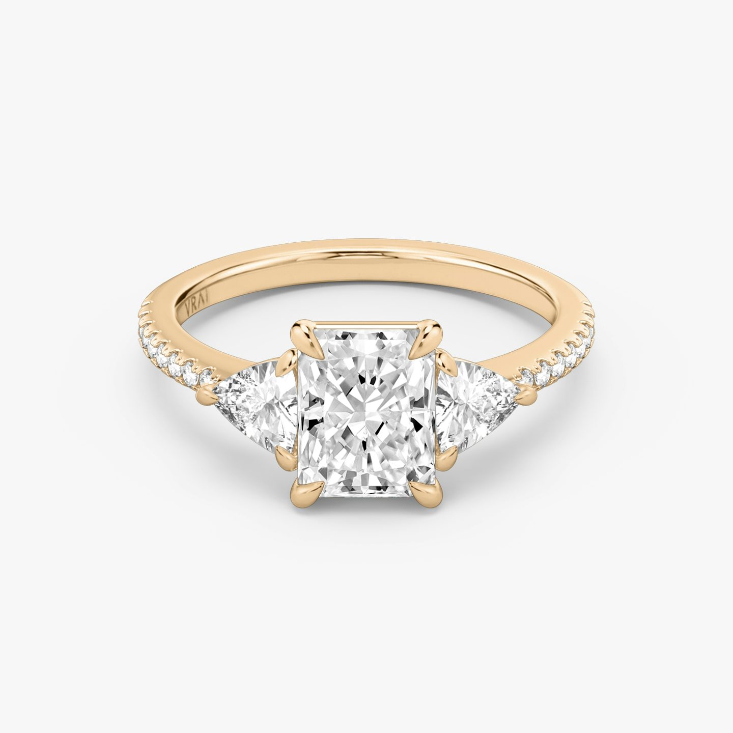 The Three Stone | Radiant | 14k | 14k Rose Gold | Band: Pavé | Side stone carat: 1/4 | Side stone shape: Trillion | Diamond orientation: vertical | Carat weight: See full inventory